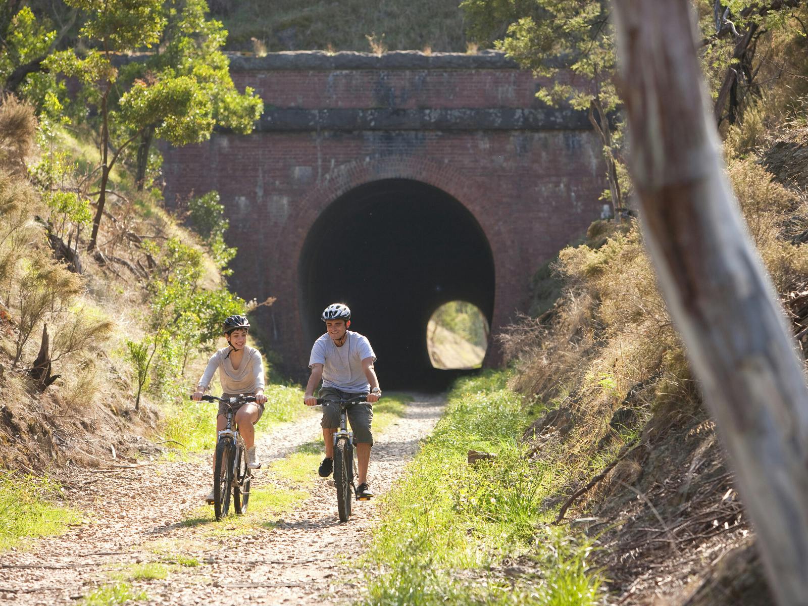 Cycling through the Cheviote Tunnel on the Great Victorian Rail Trail.