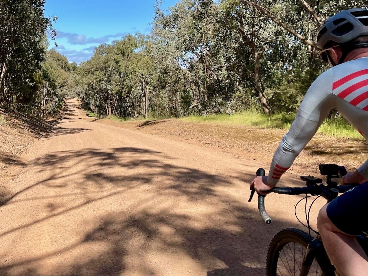 Cyclist on smooth gravel road