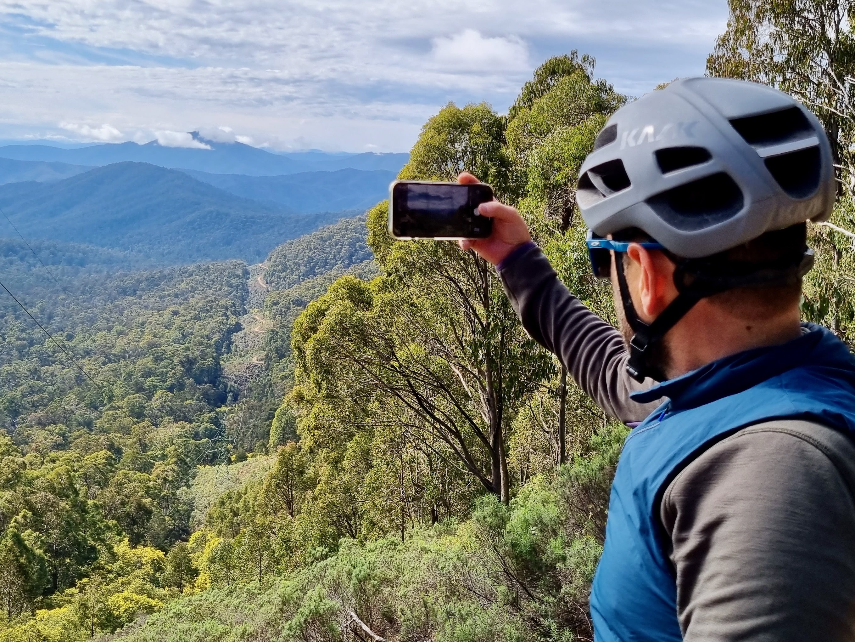 Cyclist taking photo of the views that you see along the route