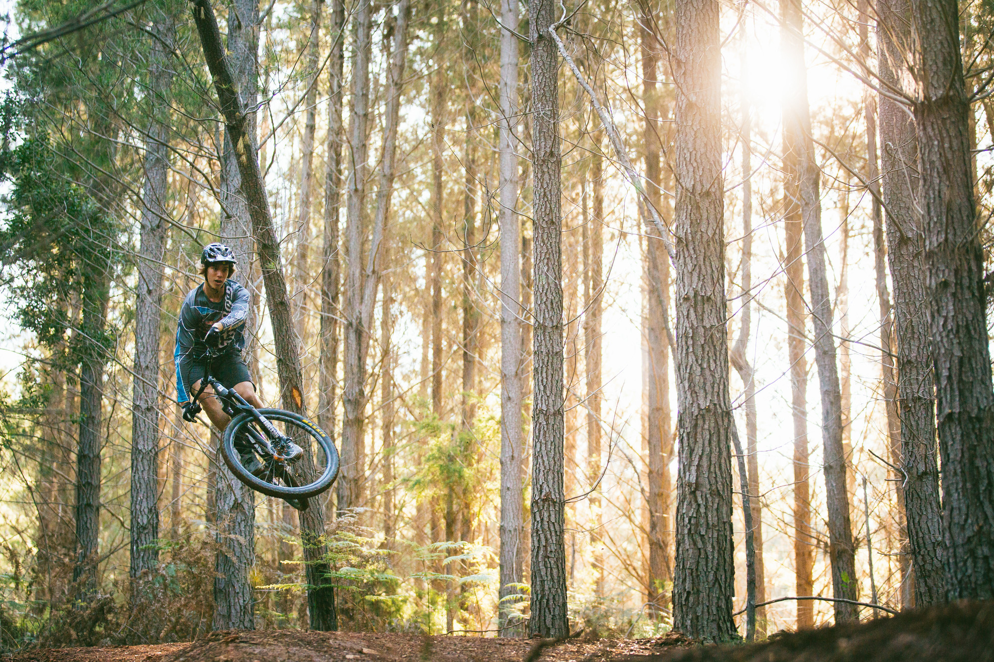 Cyclist jumping on their mountain bike at Mystic Bike Park