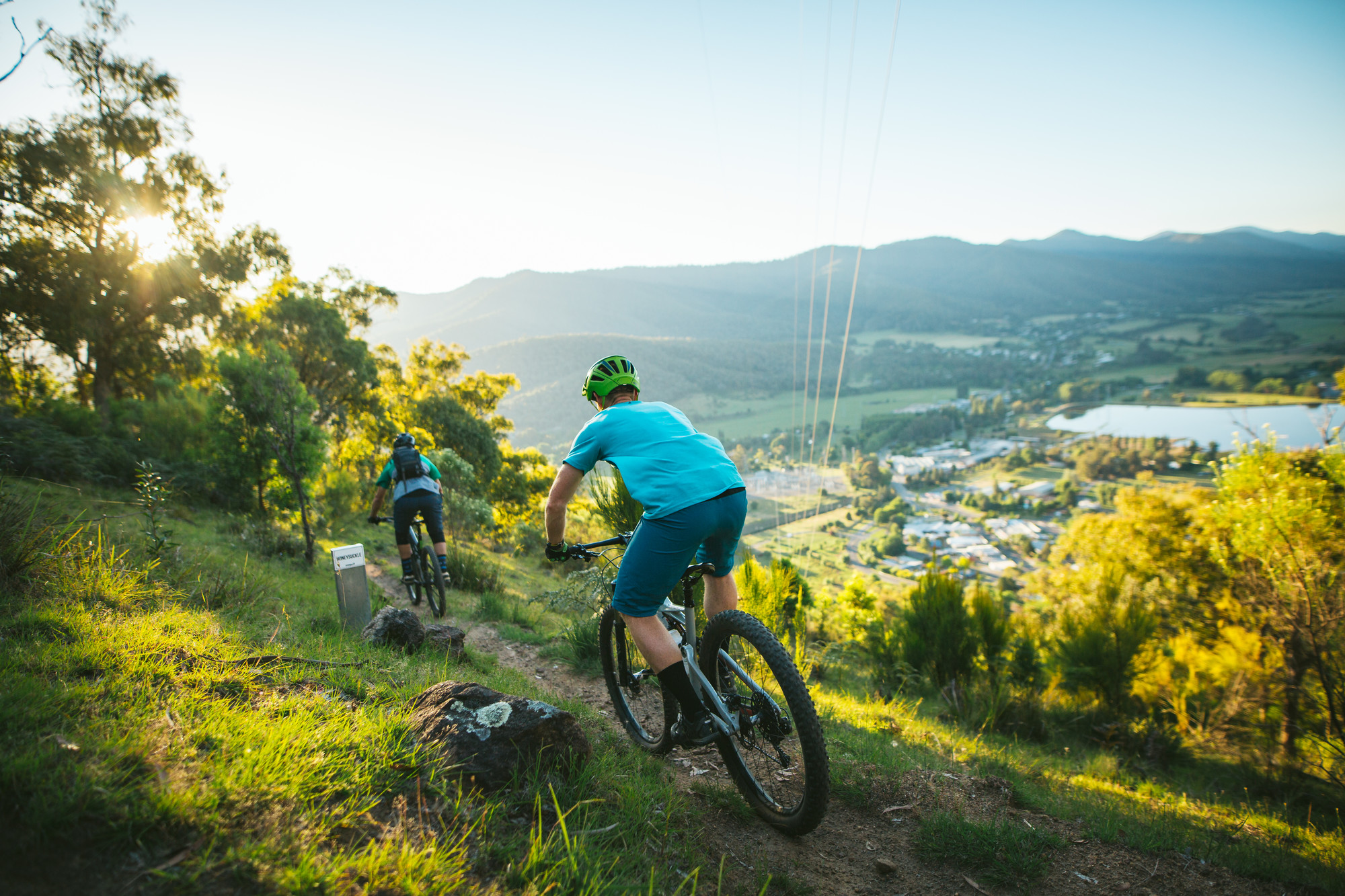 Two cyclists riding along singletrack at Big Hill Mountain Bike Park