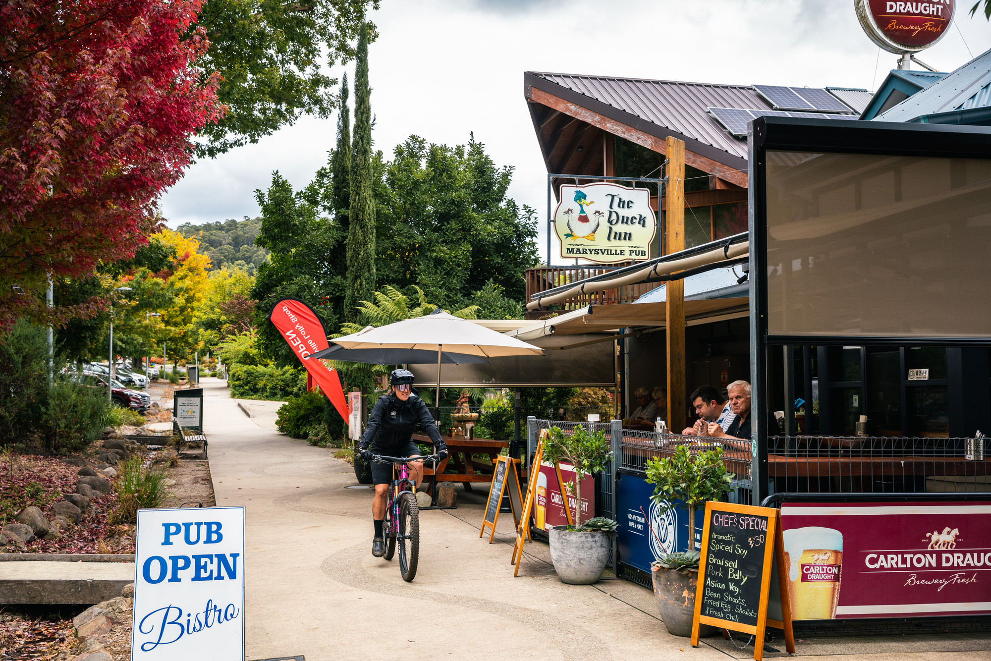 Cyclist riding through charming Marysville township