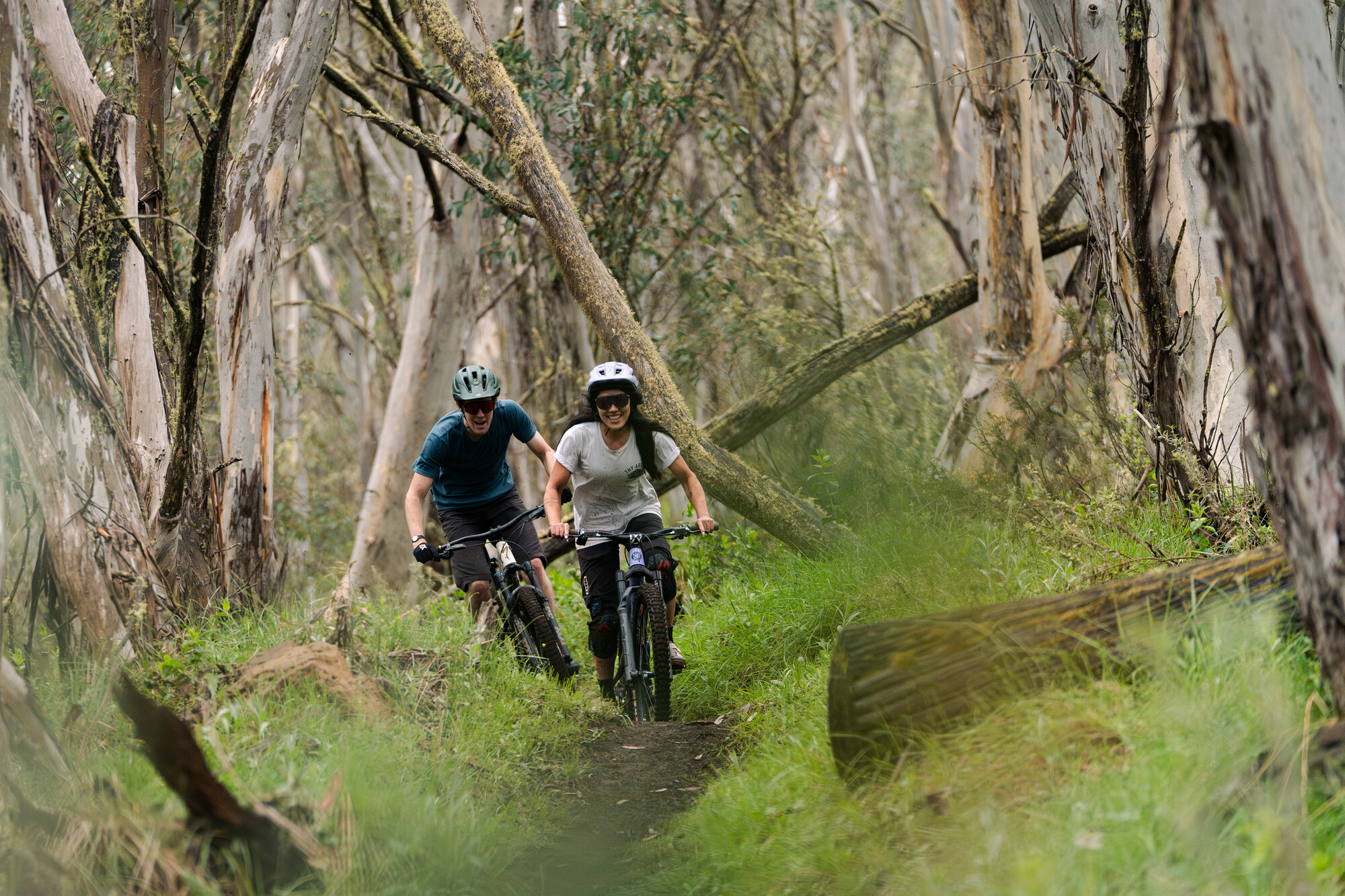 Two cyclists enjoying riding Dinner Plain Mountain Bike Park's singletrack trails