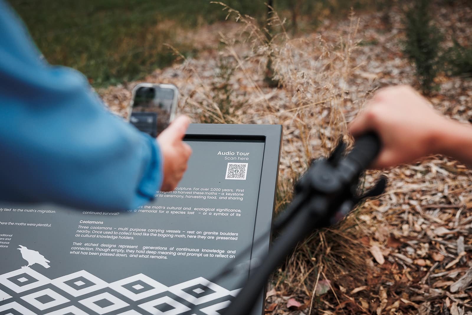 Scanning a QR code on an artwork sign