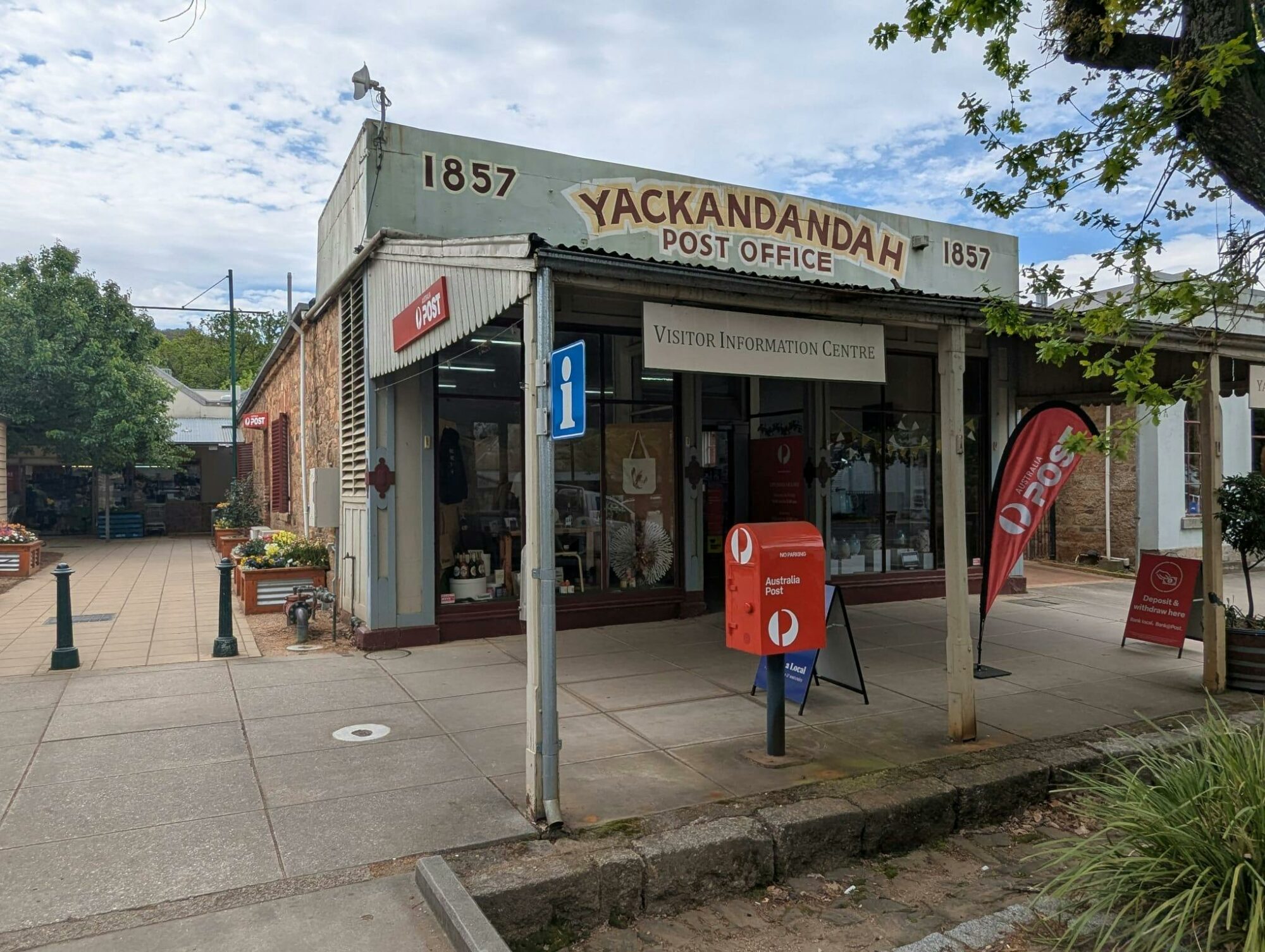 the fornt of the Visitor Informatino Centre shows a verandah and a large red post box out front