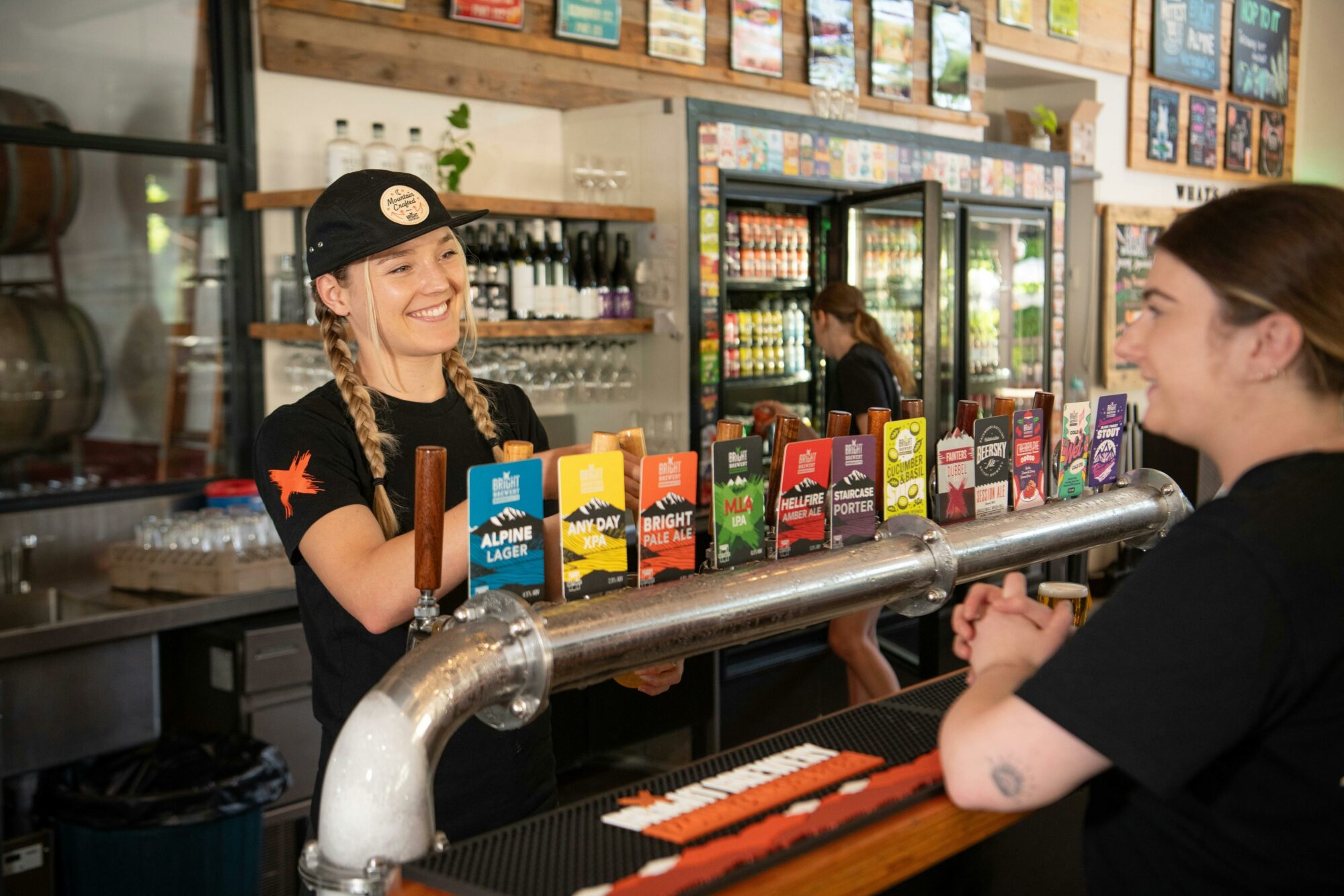 Bar tender serving a customer at the bar