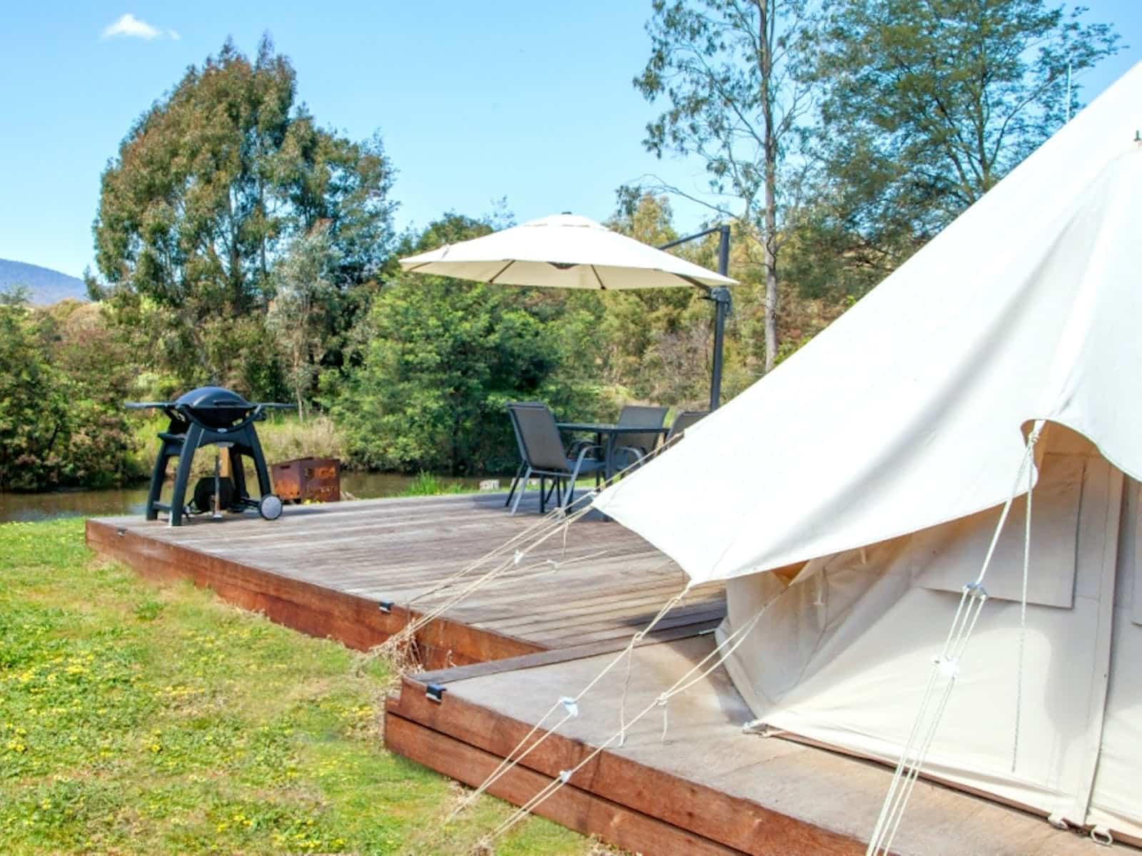 Glamping tent with deck and BBQ overlooking the river