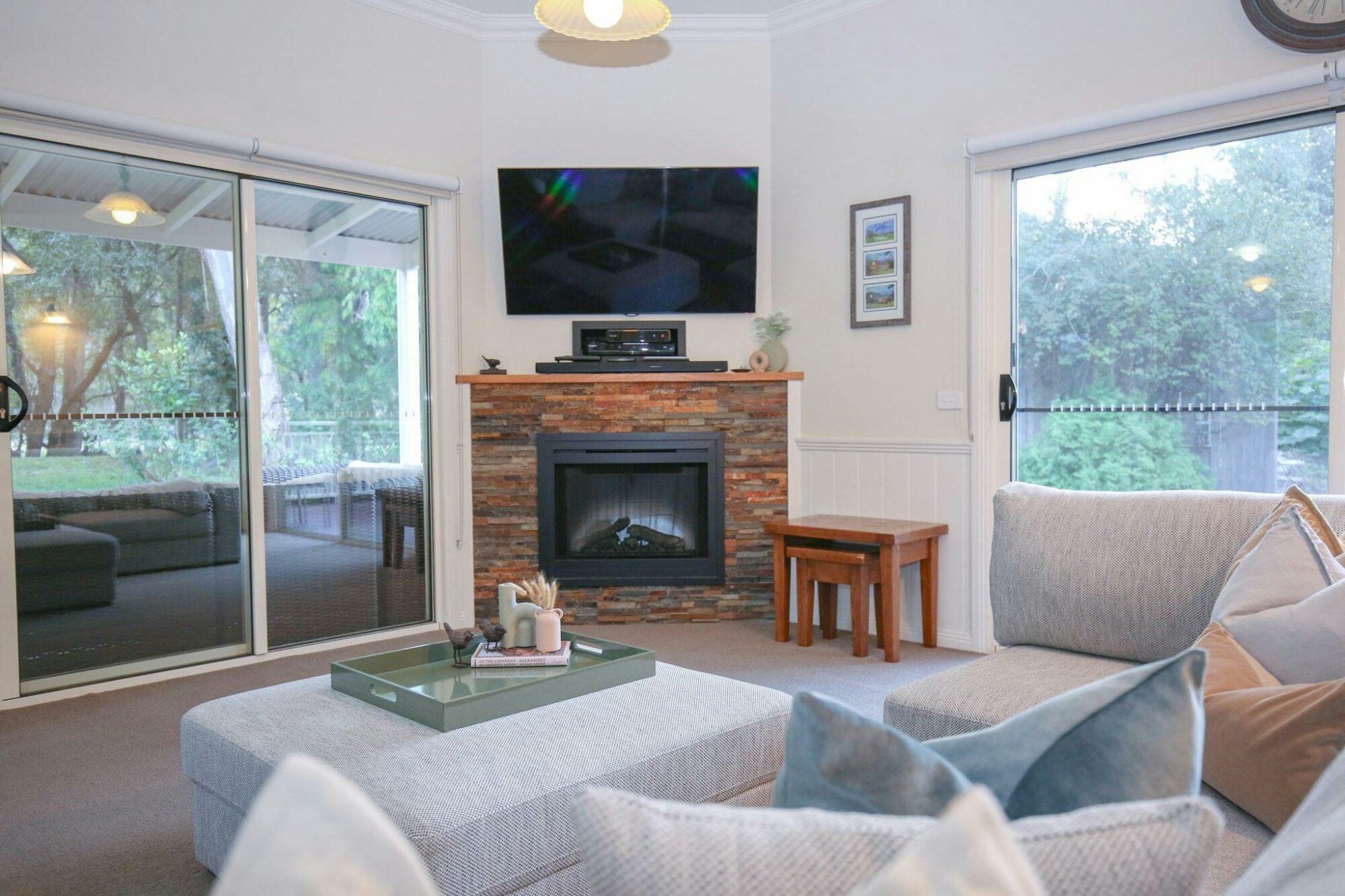 Living room with sofa, television and fireplace