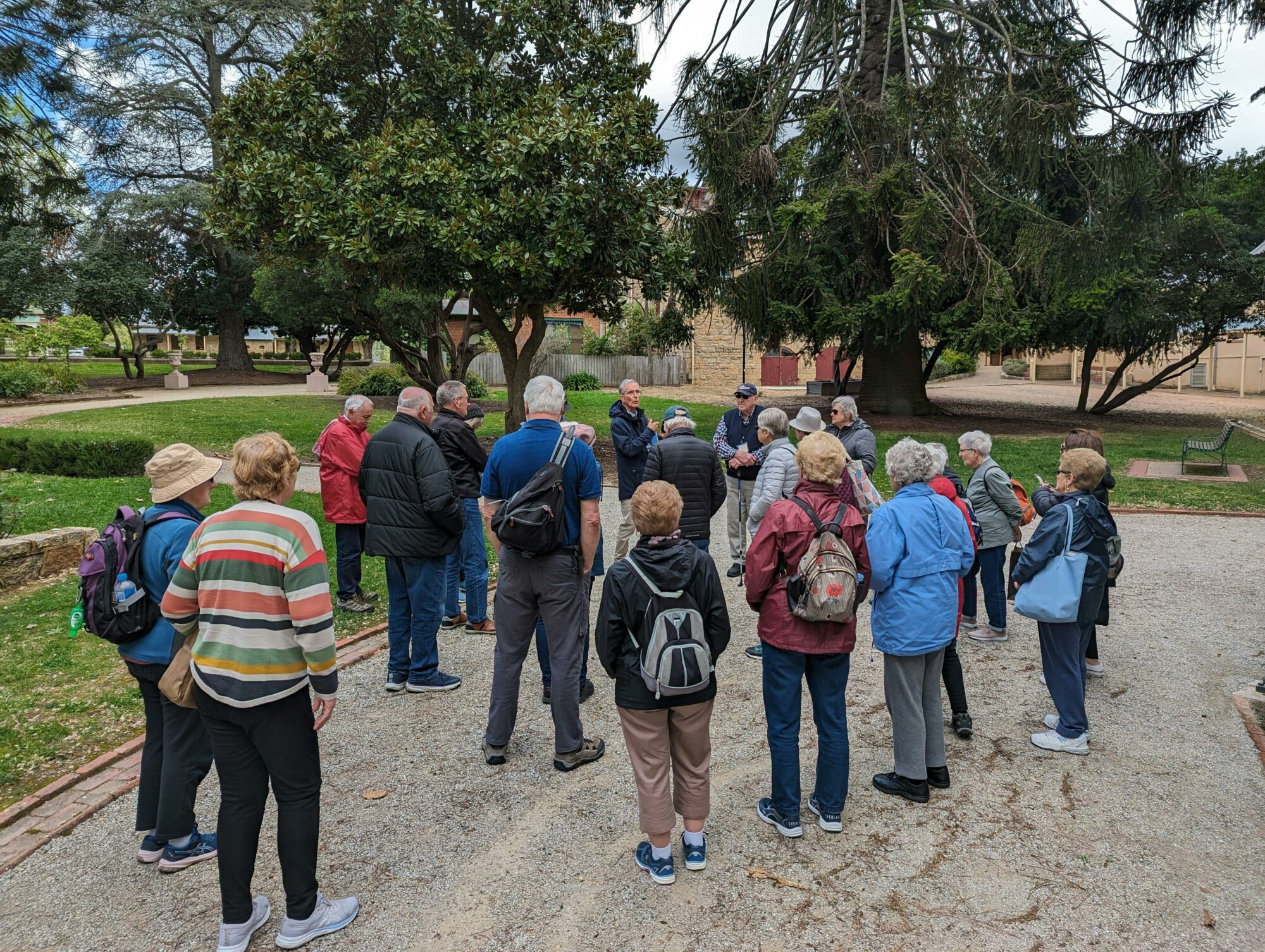 A group of people gathered around a tour guide