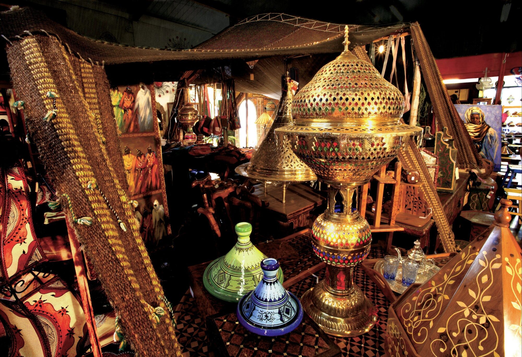 Various traditional trinkets and artistic pieces in a room with a bazaar-style appearance
