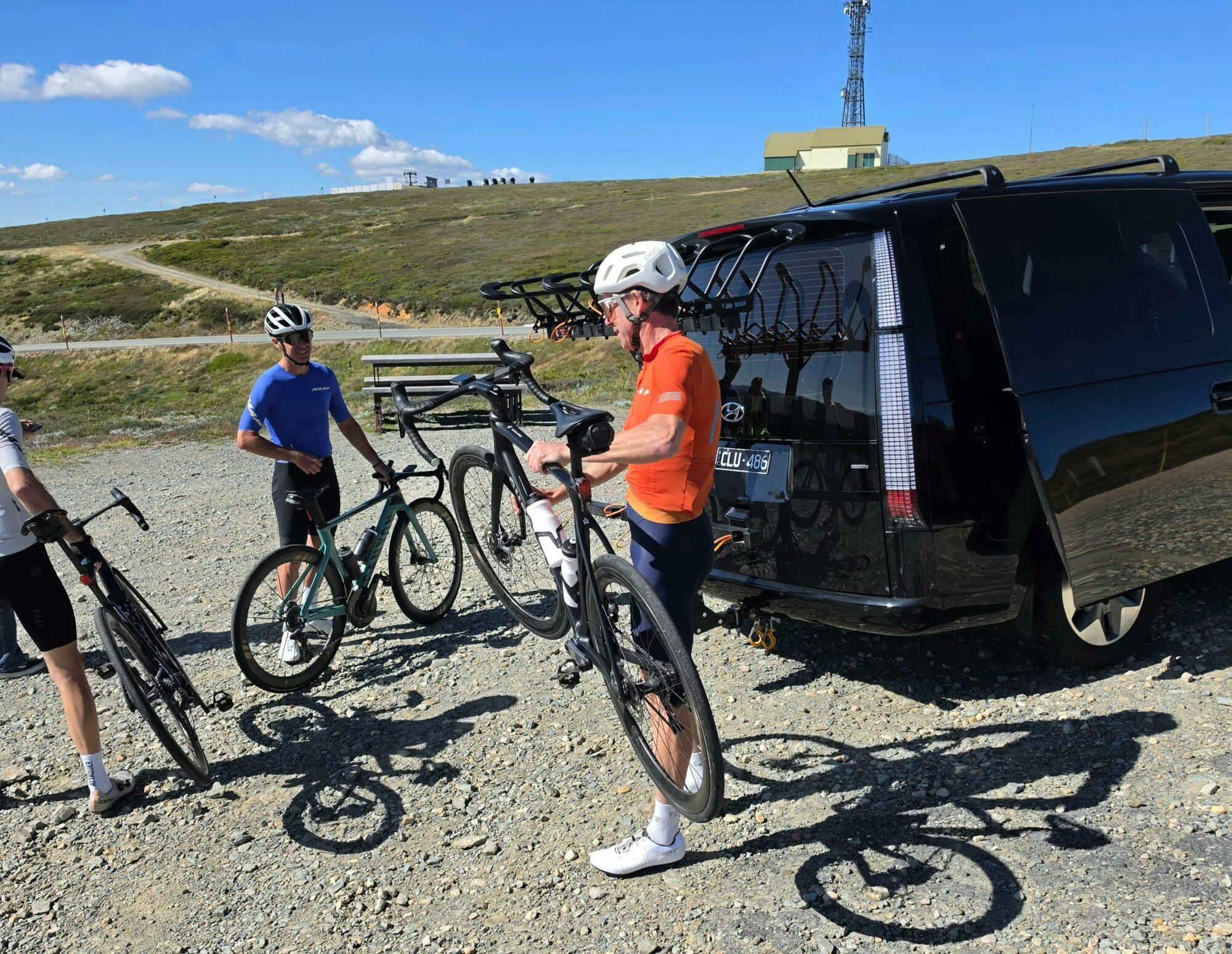 Riders loading up their road bikes on shingleback bike carrier