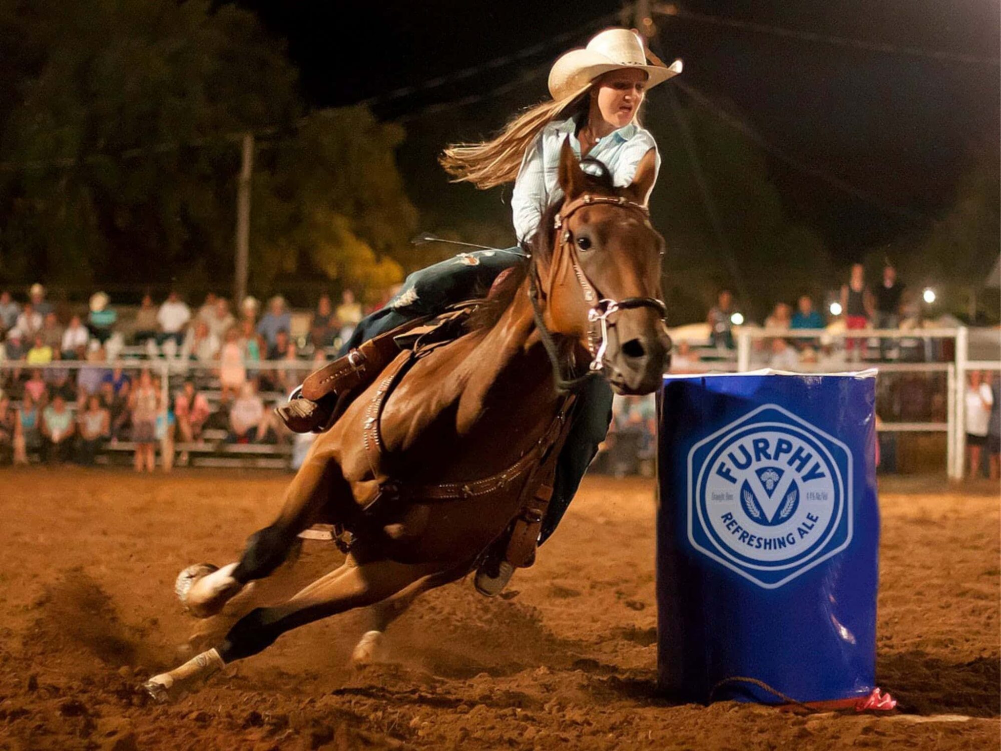 Cowgirl competing in barrel race