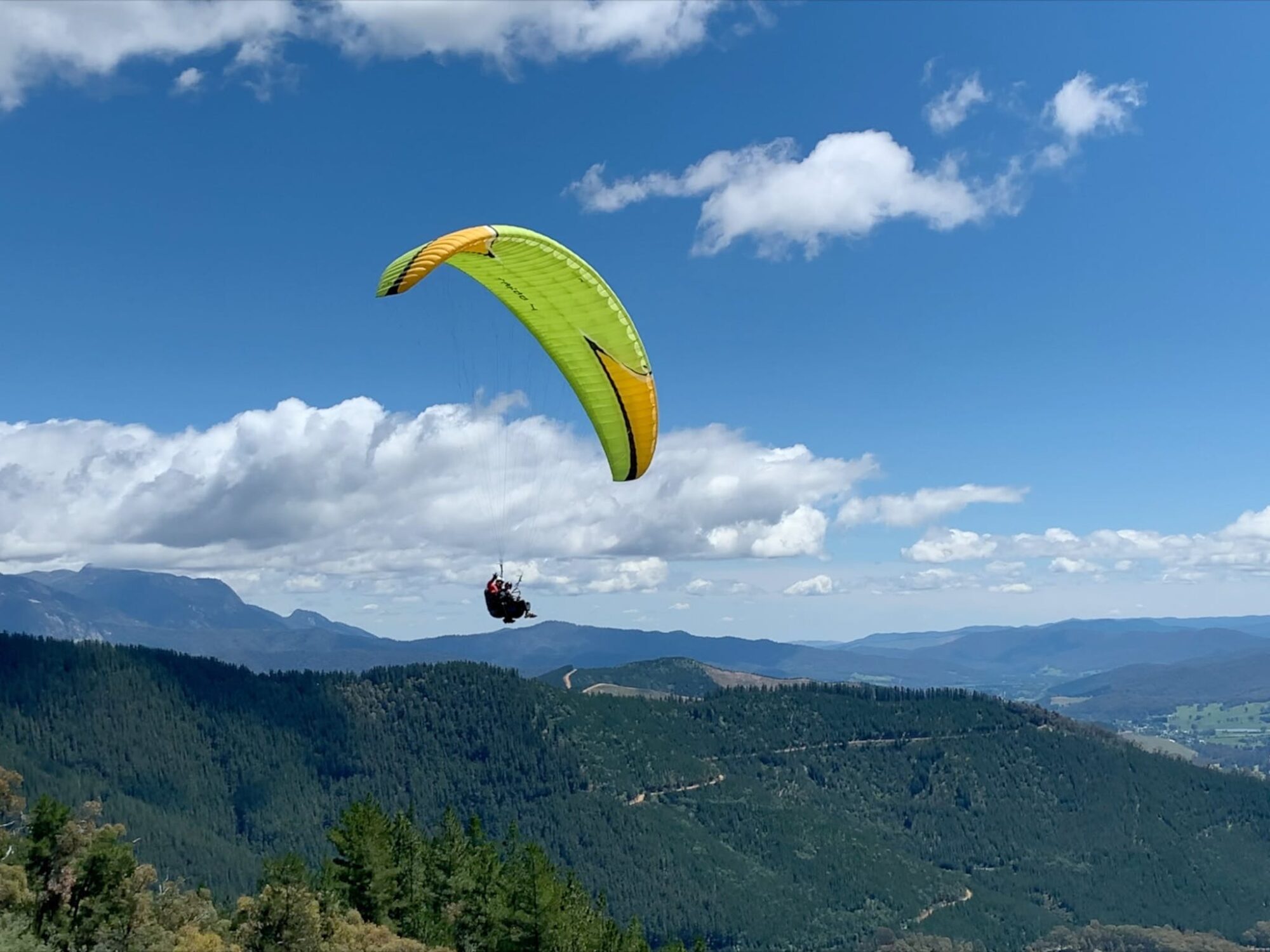 Tandem Paraglide over Mystic Mountain