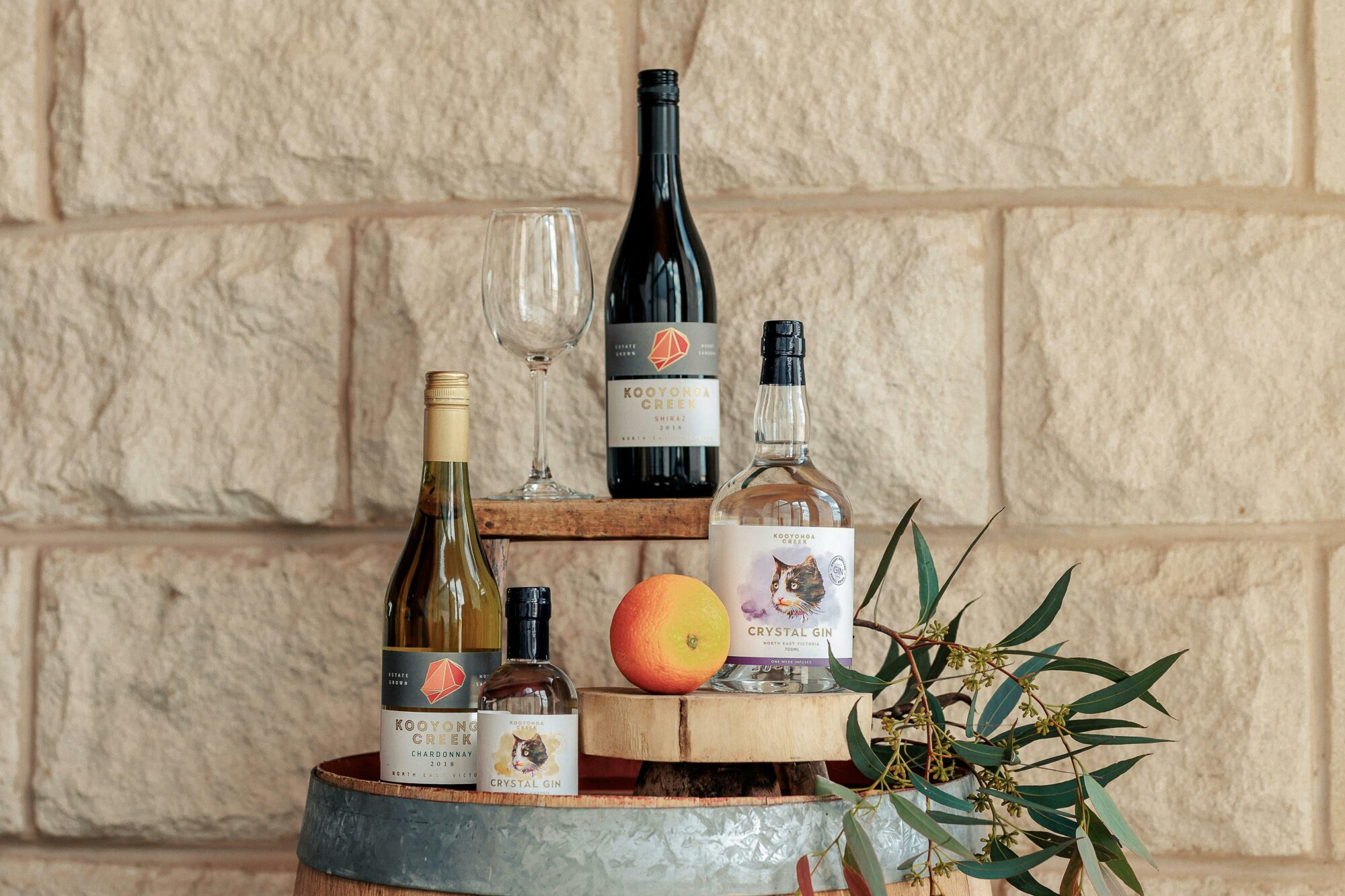 display of wine and gin bottles in a wine barrel at Kooyonga Creek Wines Cellar Door