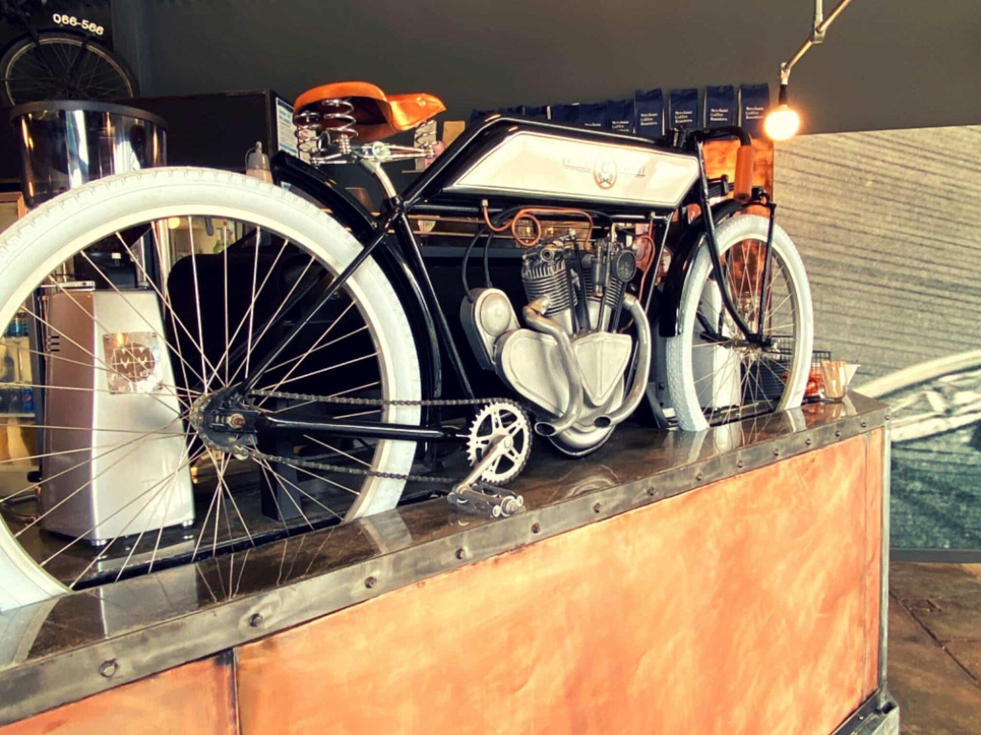 An artistic artwork of vintage motorcycle mounted on the bar
