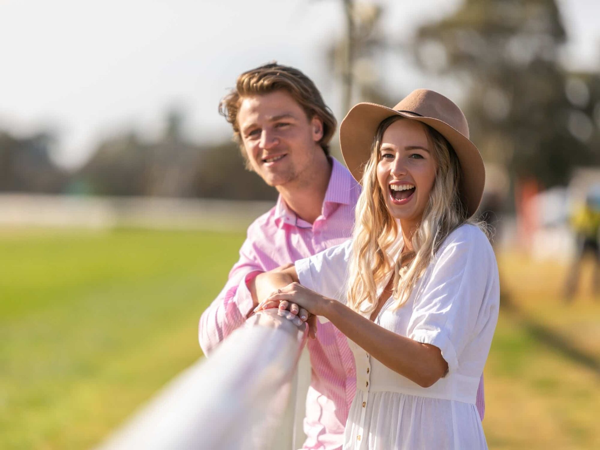 Two people watching a race