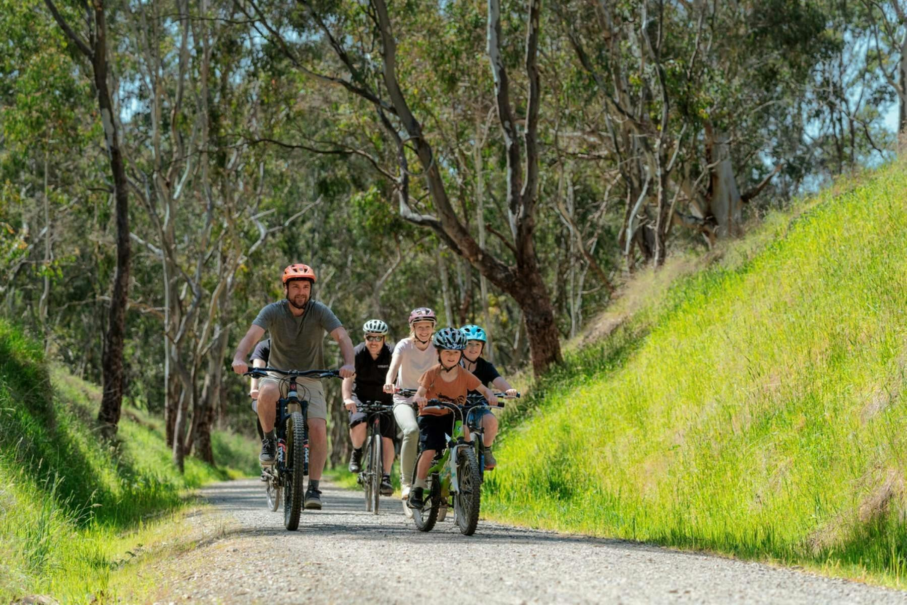 Family enjoys a guided cycling experience with Double Black Alpine on the Great Victorian Rail Trail