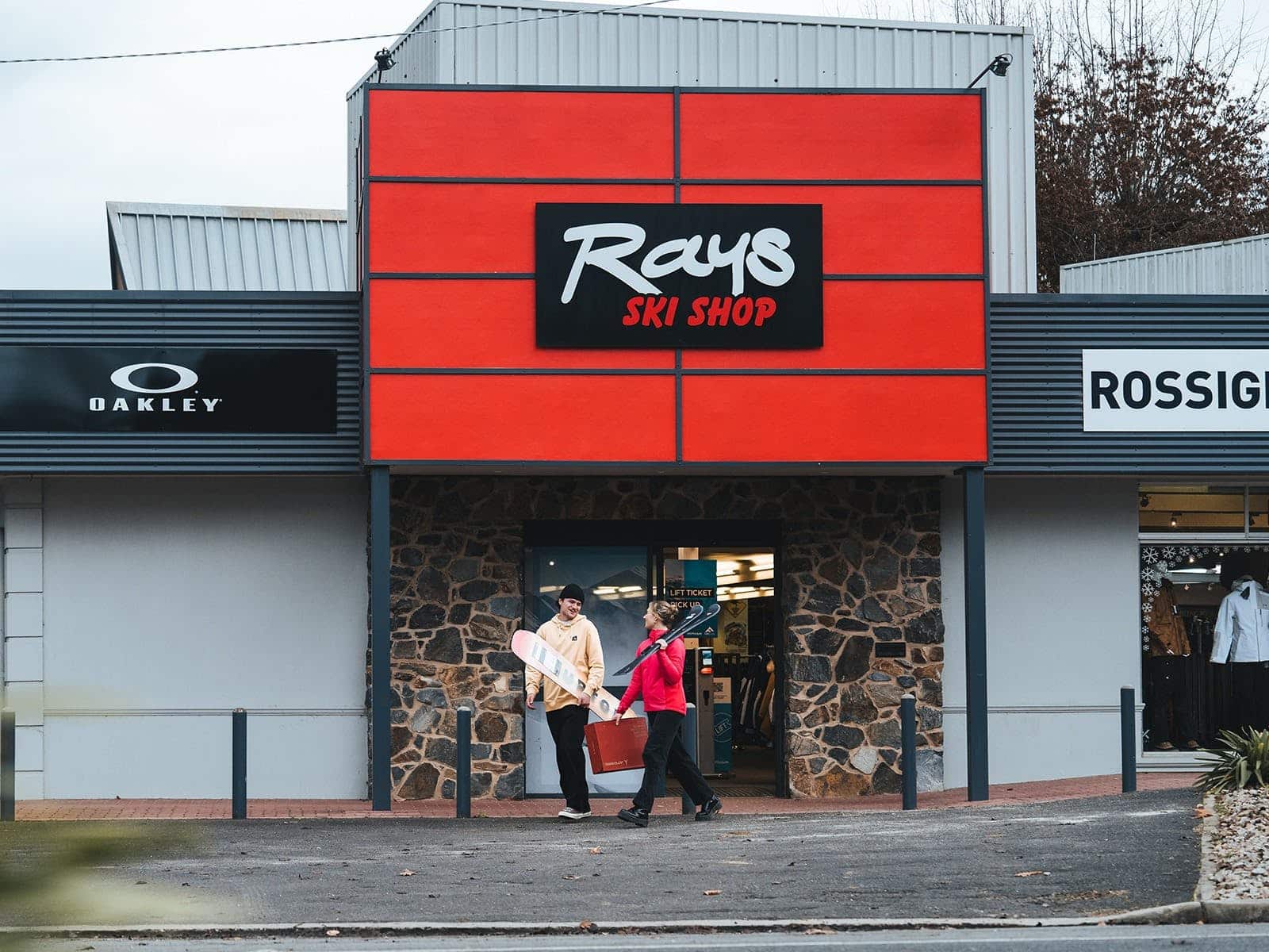 Customers exiting Rays Ski Shop with their purchases