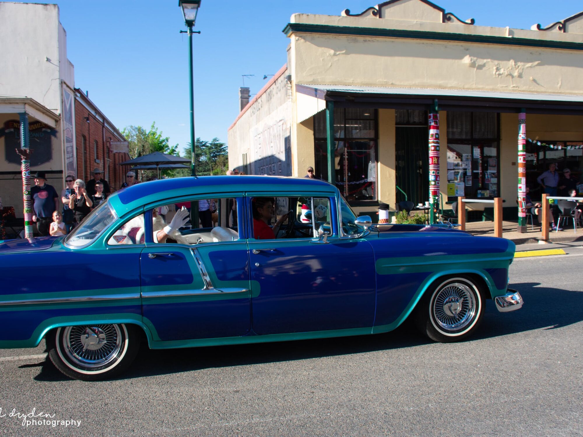 Father Christmas arriving in parade in vintage car