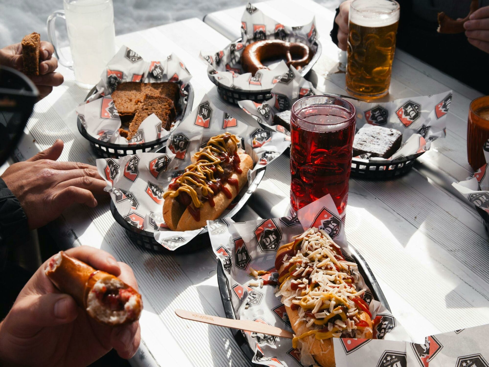 An image of a spread of kranskys, pretzels and sweets at Dicky Knees