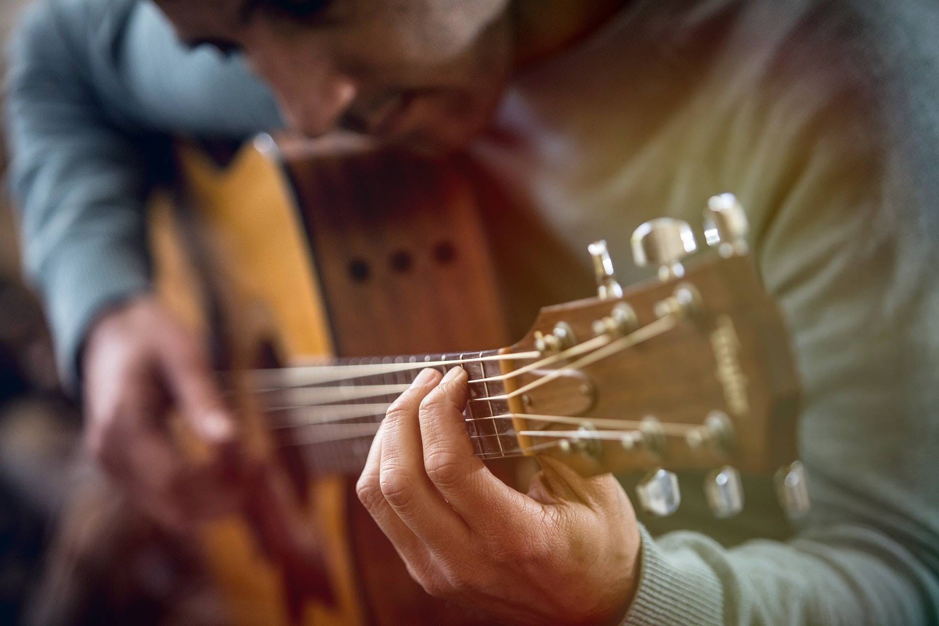 close up of guitar player