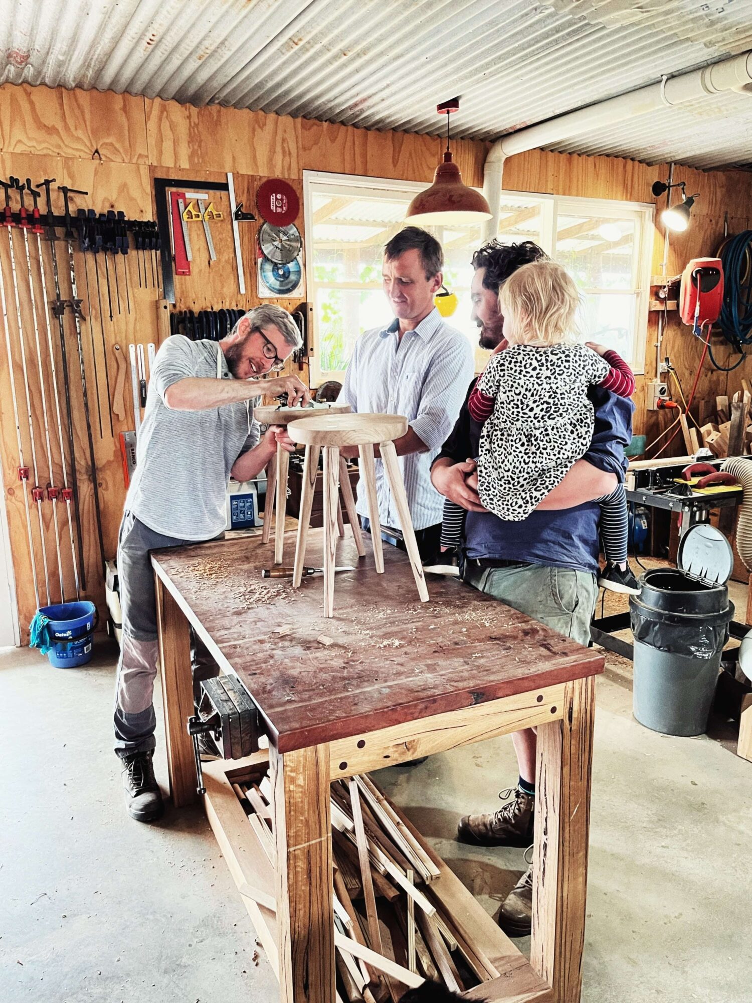 Participants working to finish stools