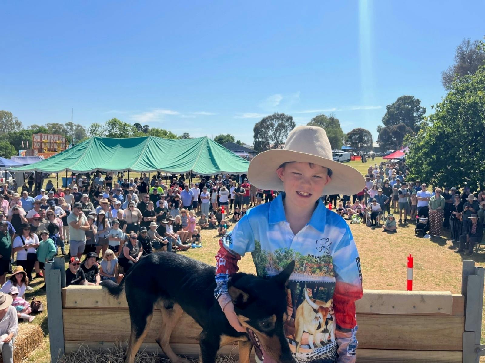 Photo taken from the top of the Dog High Jump, with the winner and his owner central to the picture.