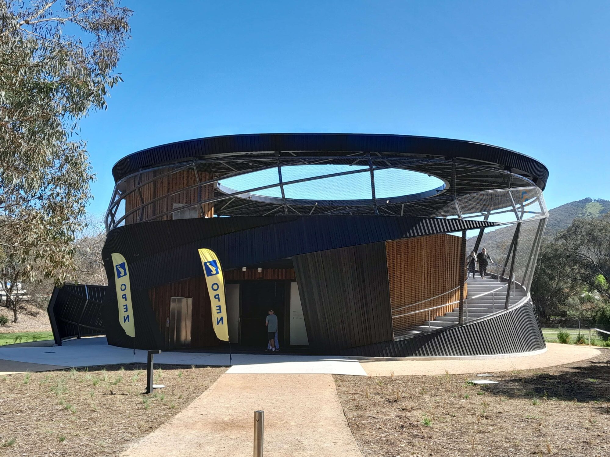 bright blue sky with Ned KElly Discovery Hub- round building with large roof top viewing platform