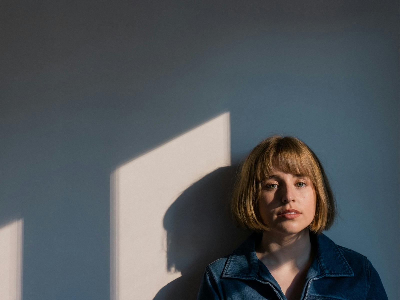 Georgie against a white wall