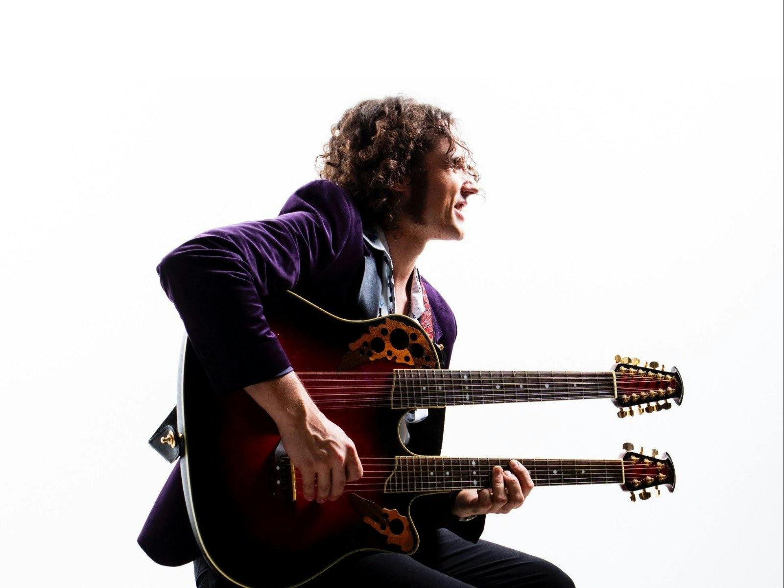 Musician RIFF with a double neck guitar