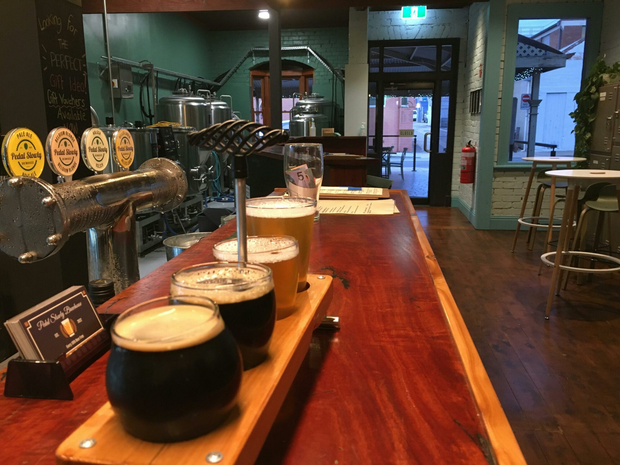 A tasting paddle of beers on the redgum bar