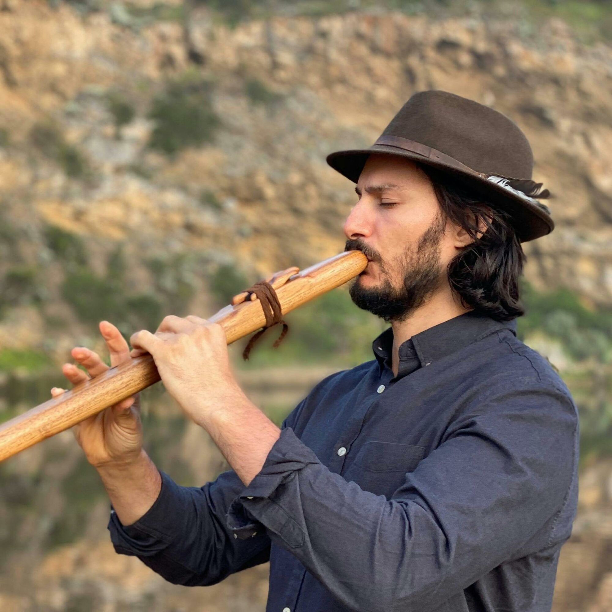 Retreat host, Christian Dimarco, playing a wooden musical instrument