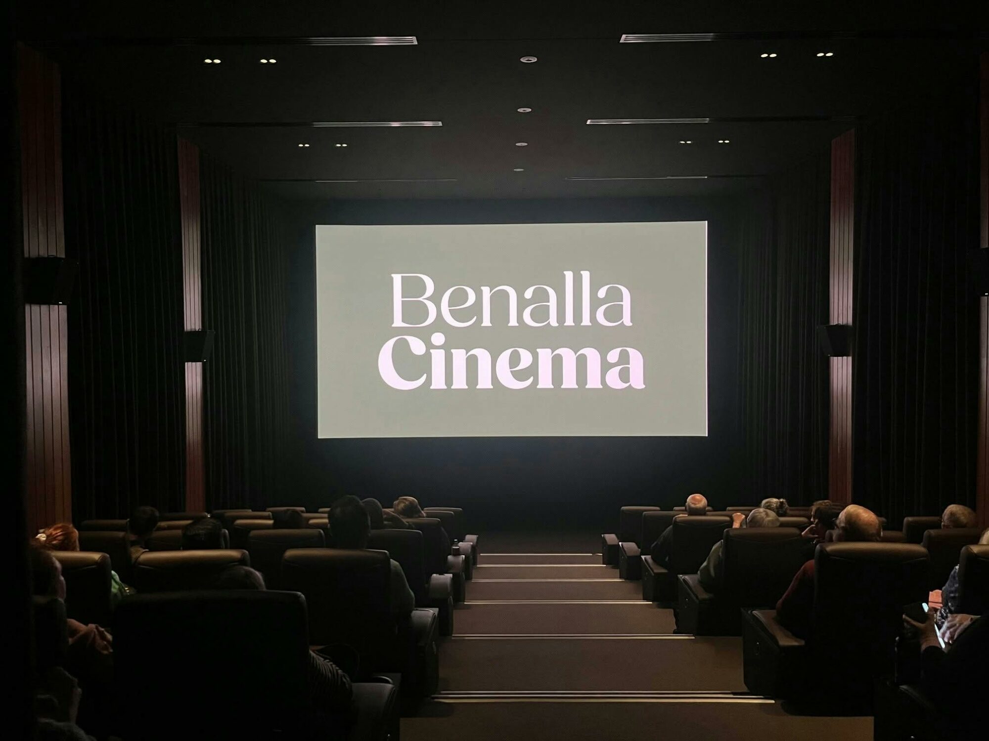 Green back ground with white Benalla Cinema writing.  Image showcases the cinema.