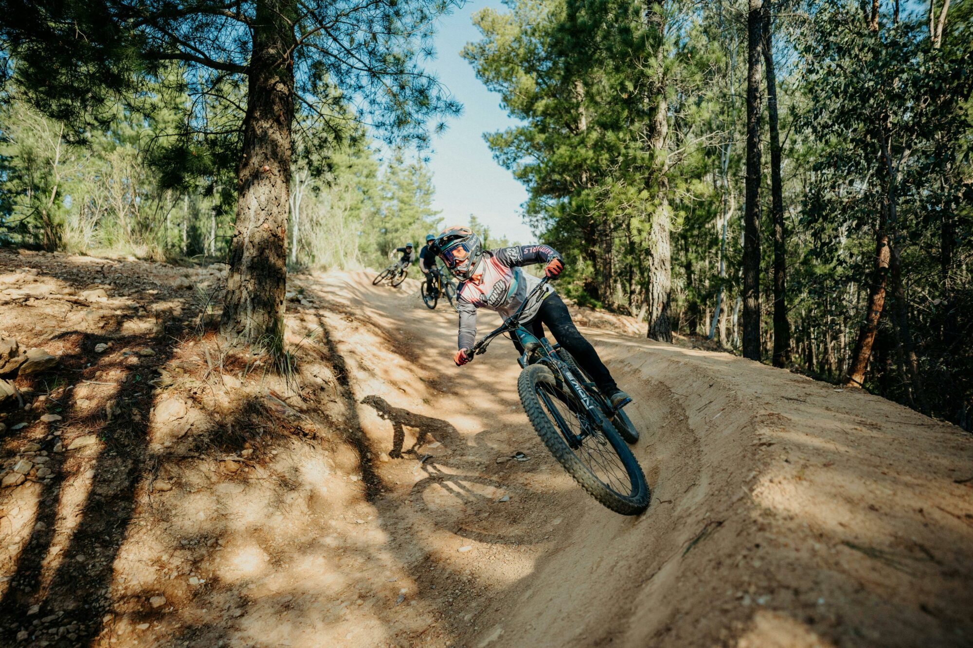 Riders enjoying Hero Trail, an intermediate jump trail