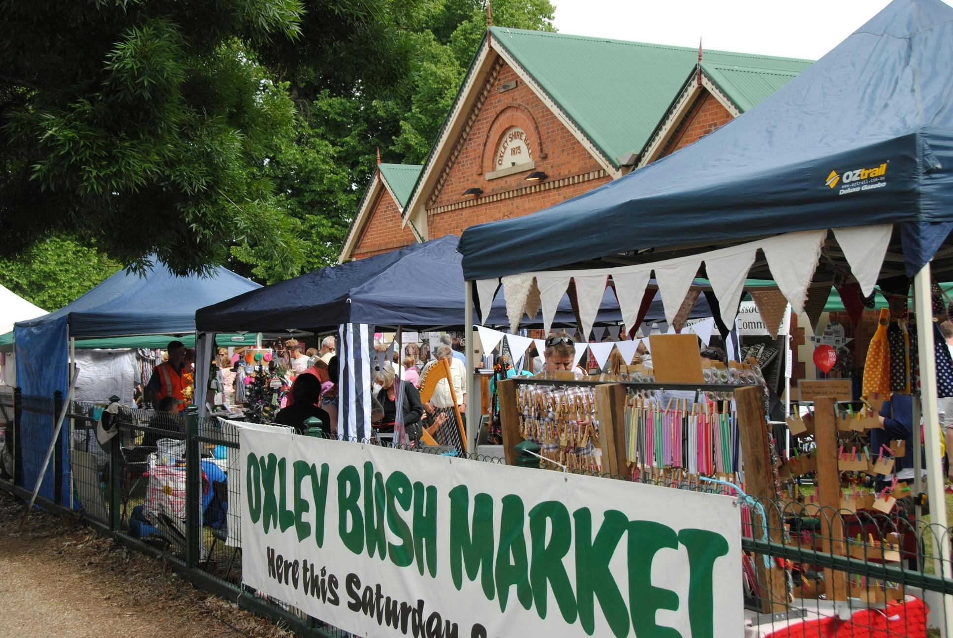 Market stalls and signage at the front of an old heritage building in country Victoria