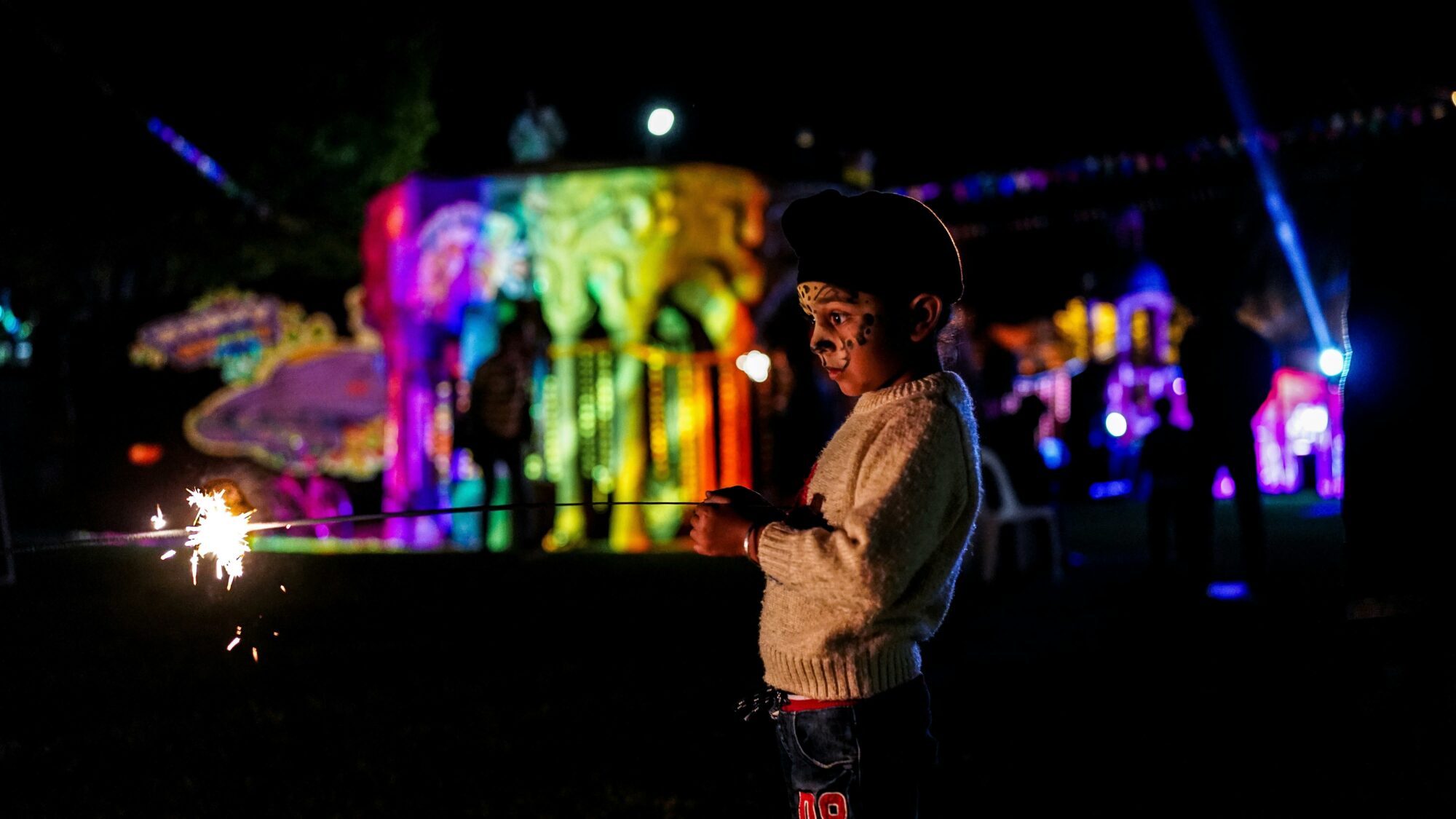 Young person enjoying the colours of Diwali