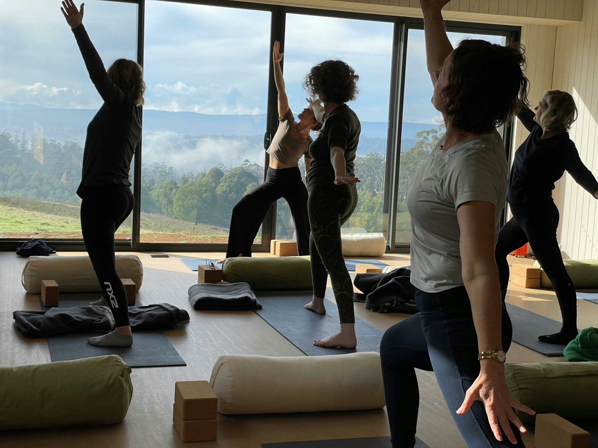 Women doing yoga in the private yoga room