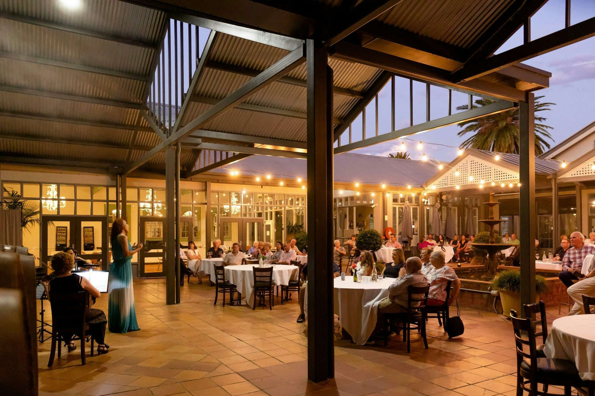 a courtyard with fairy lights