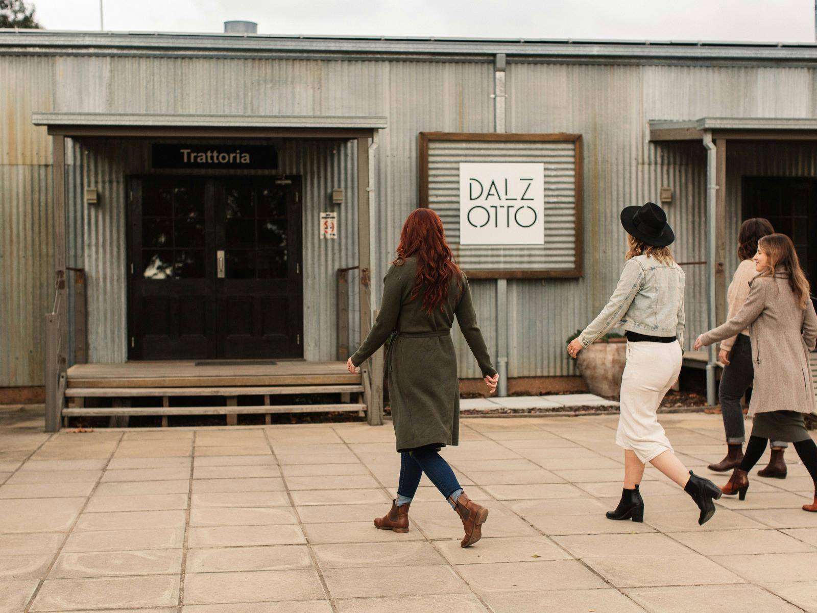Dal Zotto Wines Trattoria with four girls walking in the door