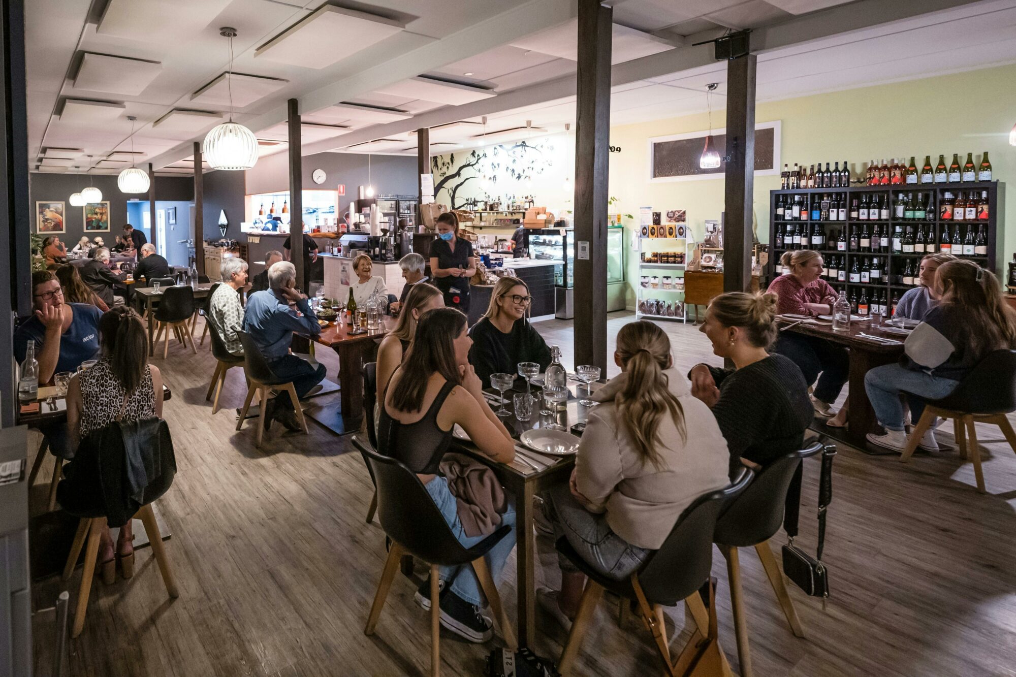 Photo of inside of the restaurant with guests dining and enjoying themselves