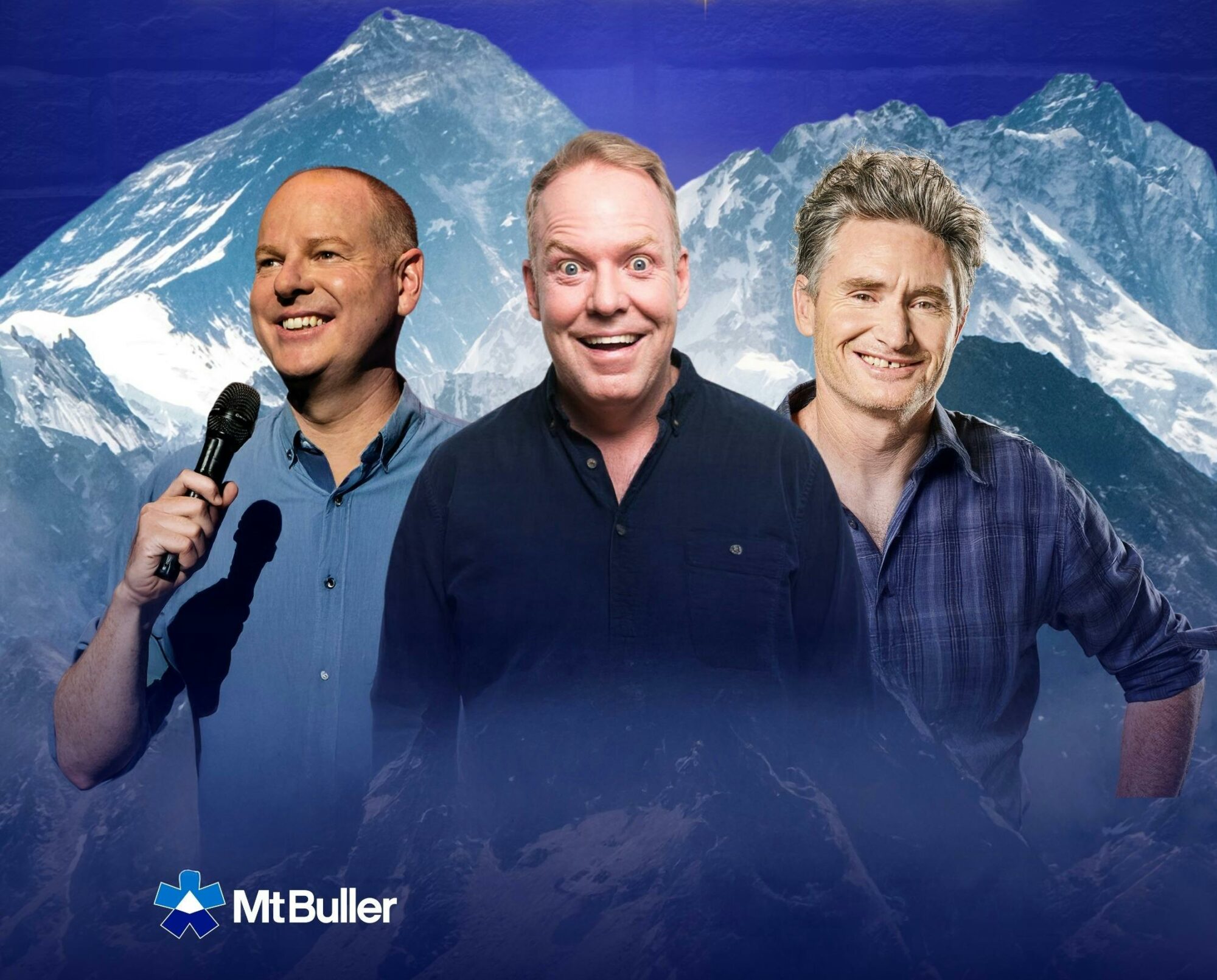 three men looking into the camera and smiling with the mountains in the background