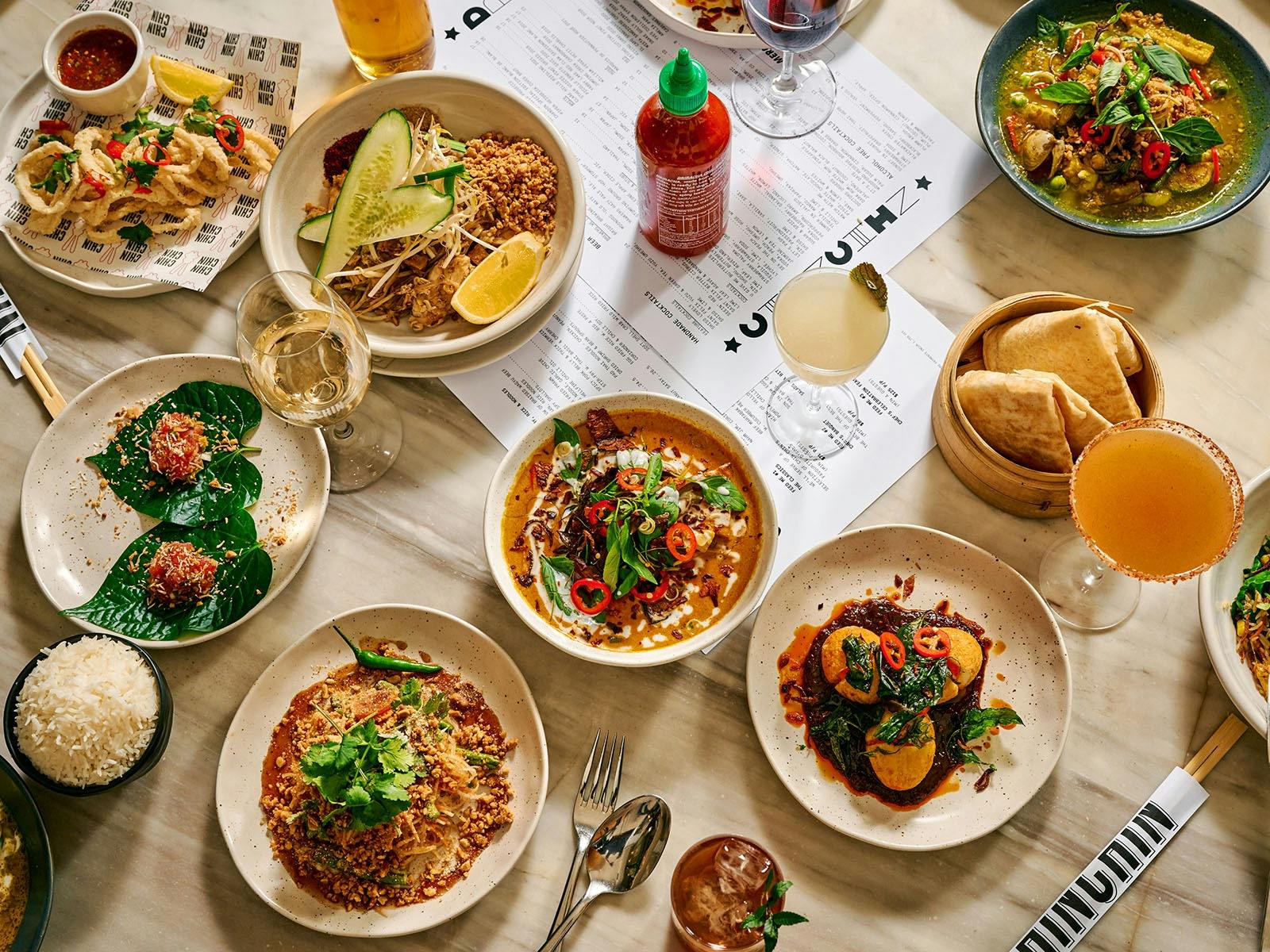 various food dishes on a table at chin chin