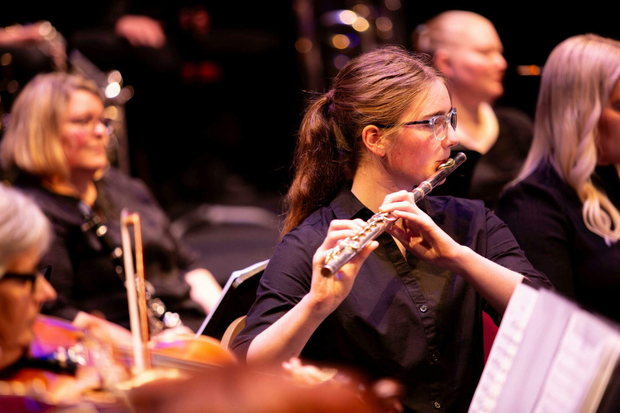 Young person playing the flute.