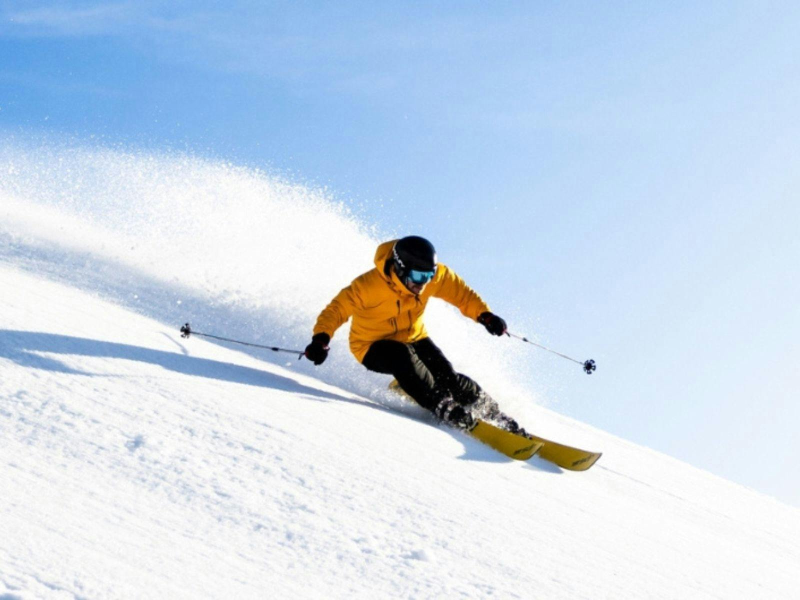 Skier in a yellow jacket at Mount Hotham