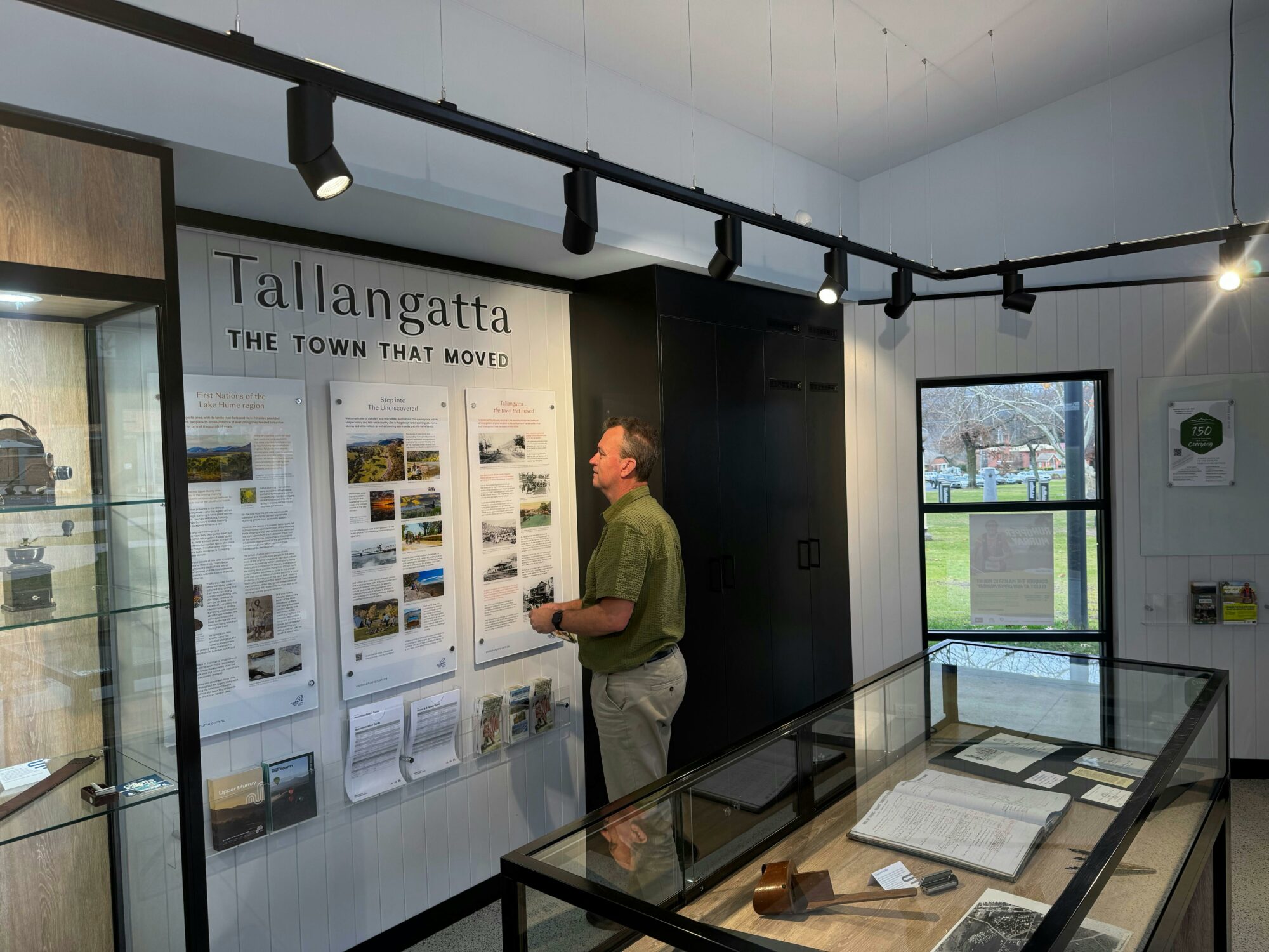 a person looking at an information board at the Tallangatta Visitor Information Centre