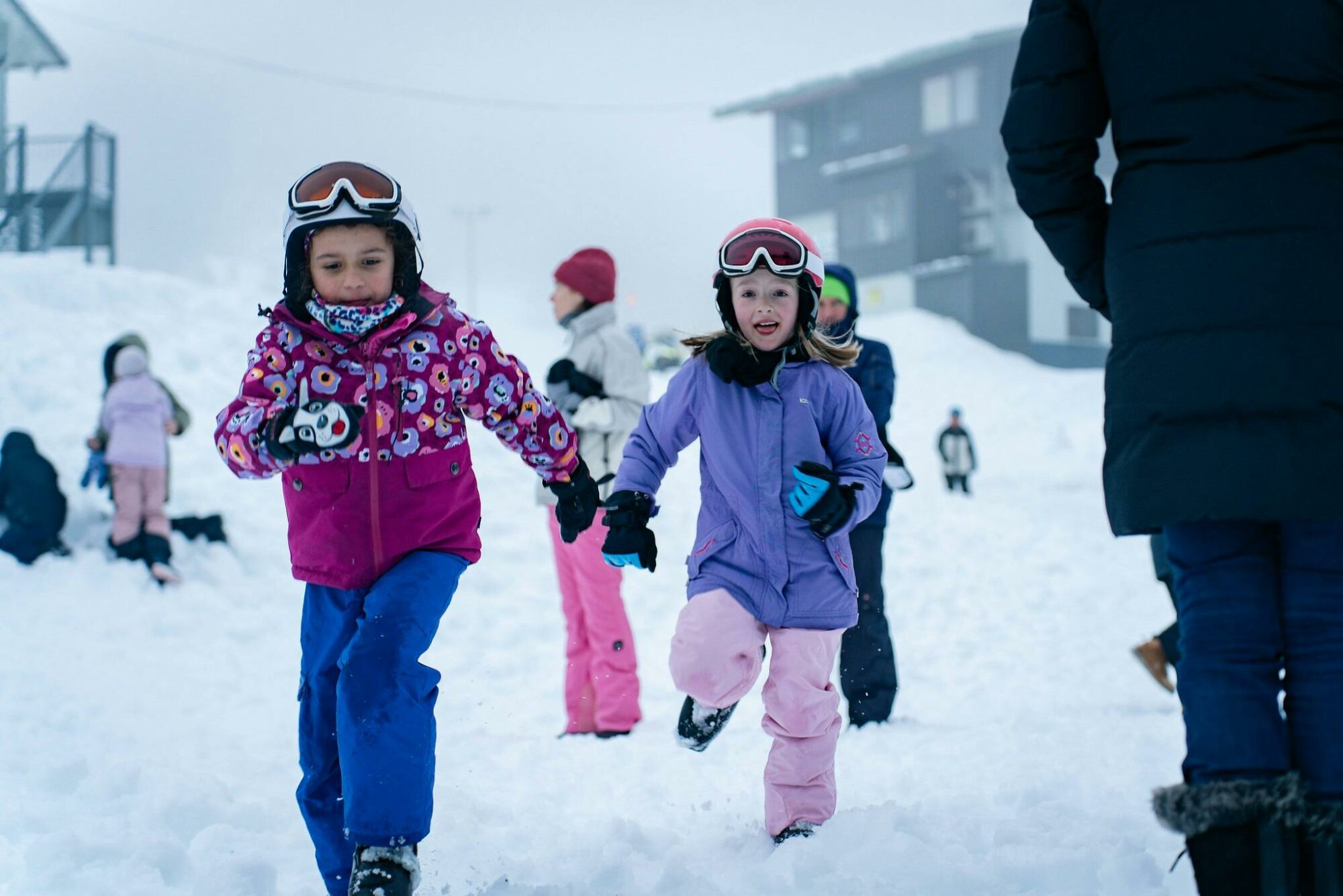 Kids having fun running in the snow