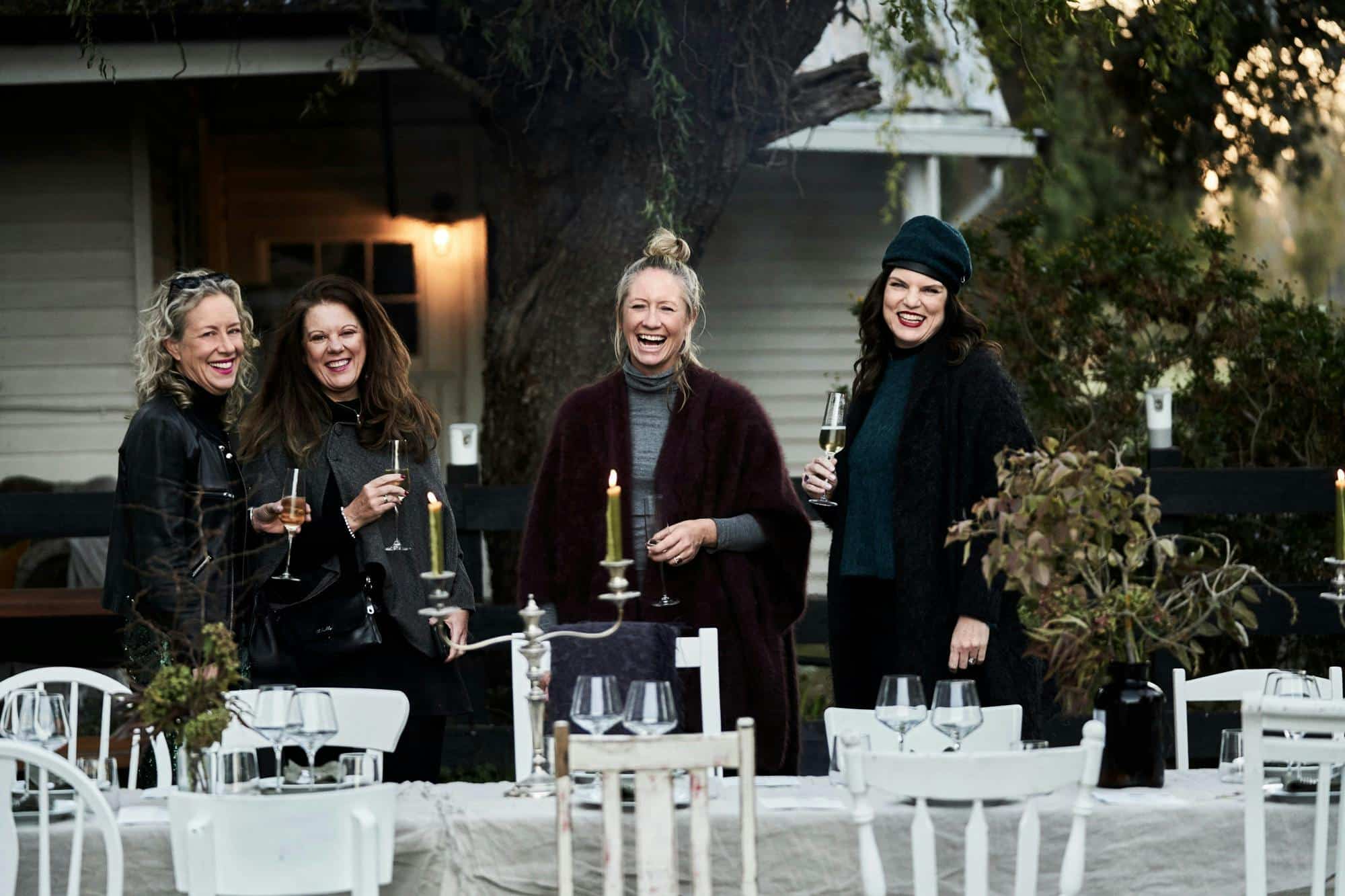People smiling and standing at the Long Table Lunch at Dunmore Farm