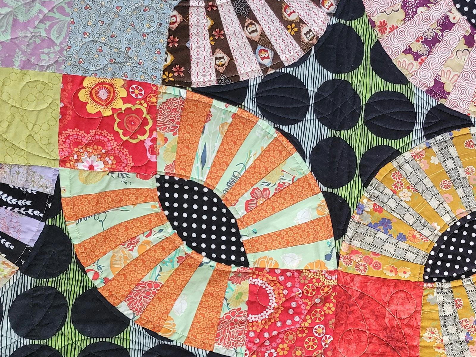 A close up of one of the exquisite quilts on display at the Birds of a Feather Artisans Market