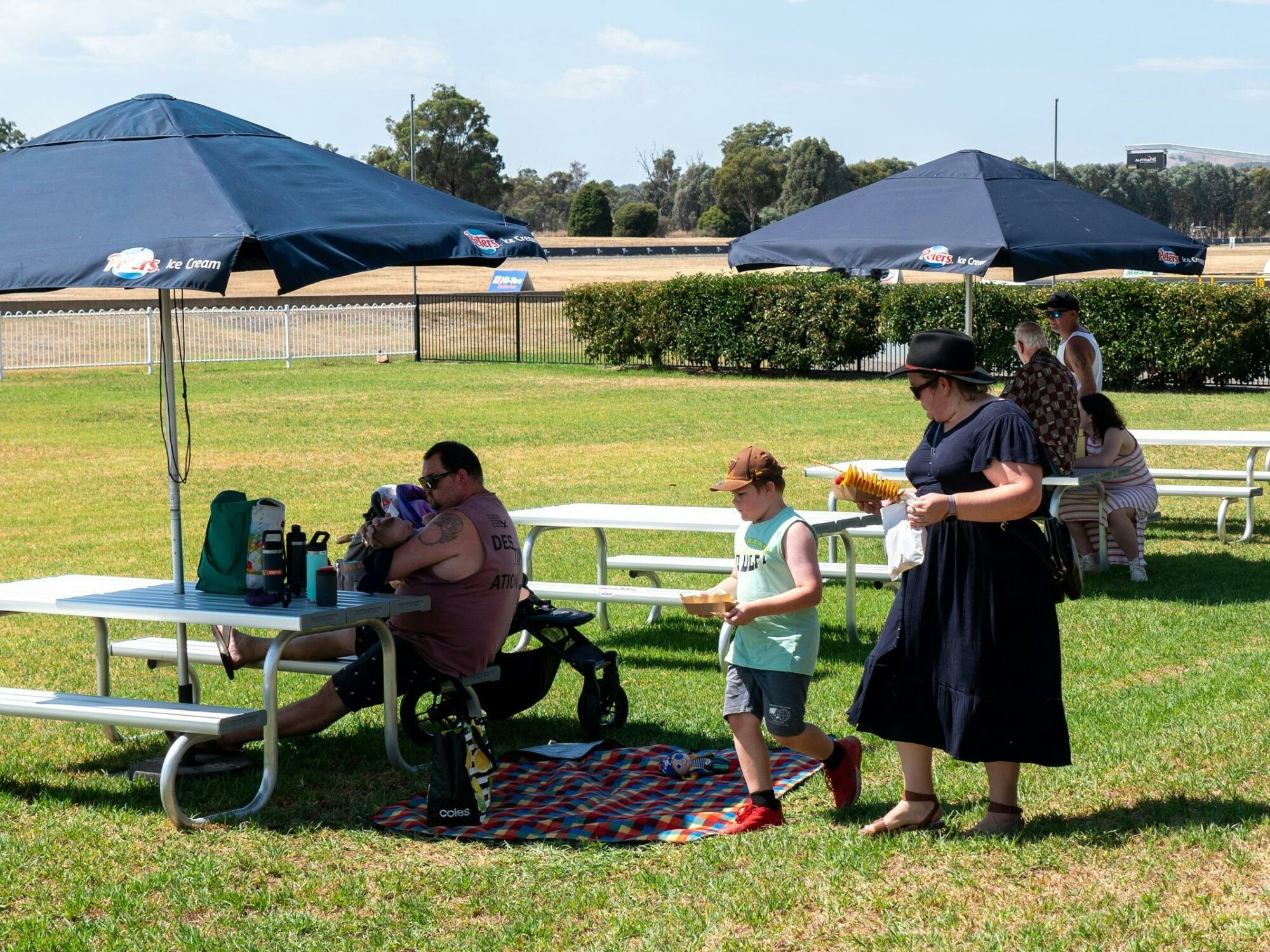 Outdoor seating with umbrellas  and people