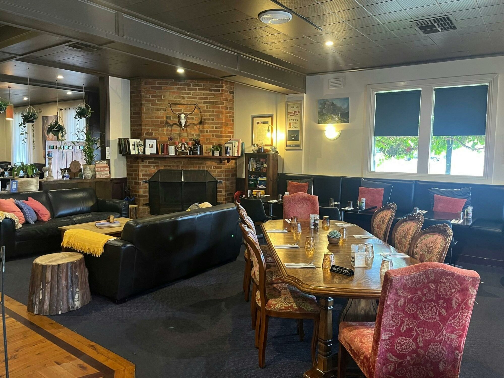 Interior of the hotel at the Northo Benalla.  Dining and seating area near internal fire place.